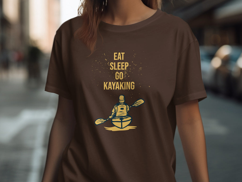 Brown t-shirt with "EAT SLEEP GO KAYAKING" and kayaker graphic.