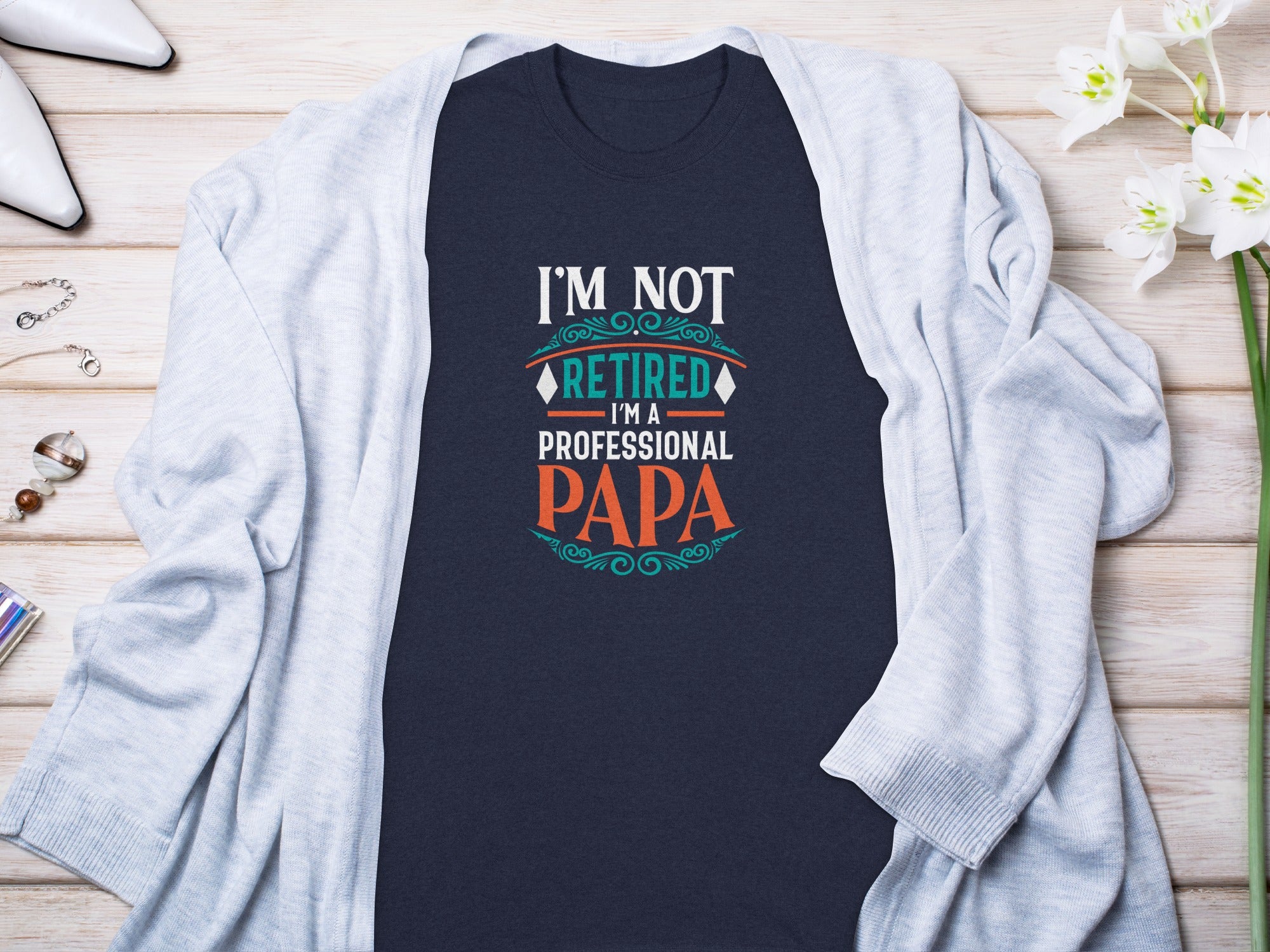 Dark blue t-shirt with "I'M NOT RETIRED I'M A PROFESSIONAL PAPA" text.