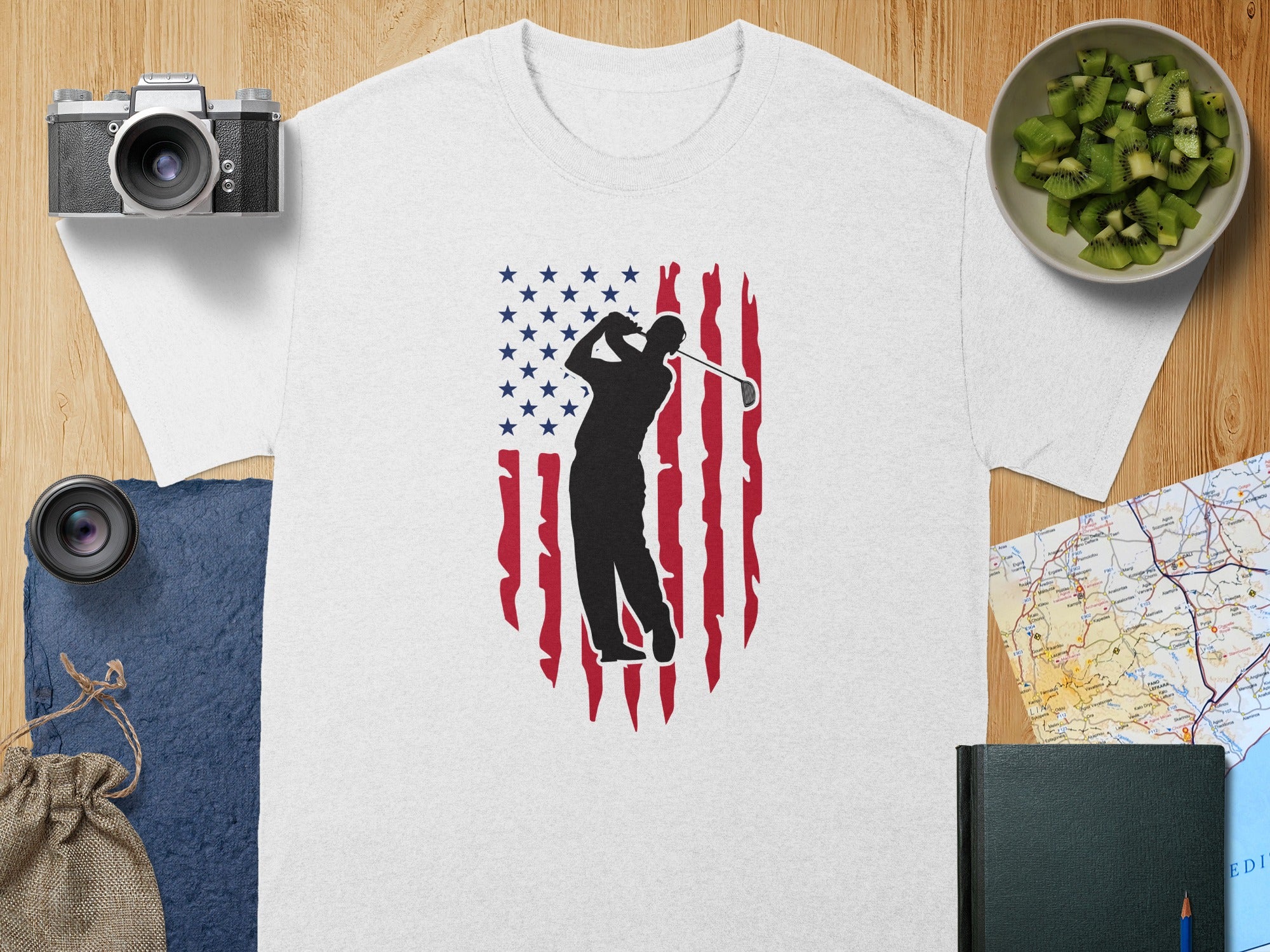 White t-shirt with black golfer silhouette over distressed US flag design.