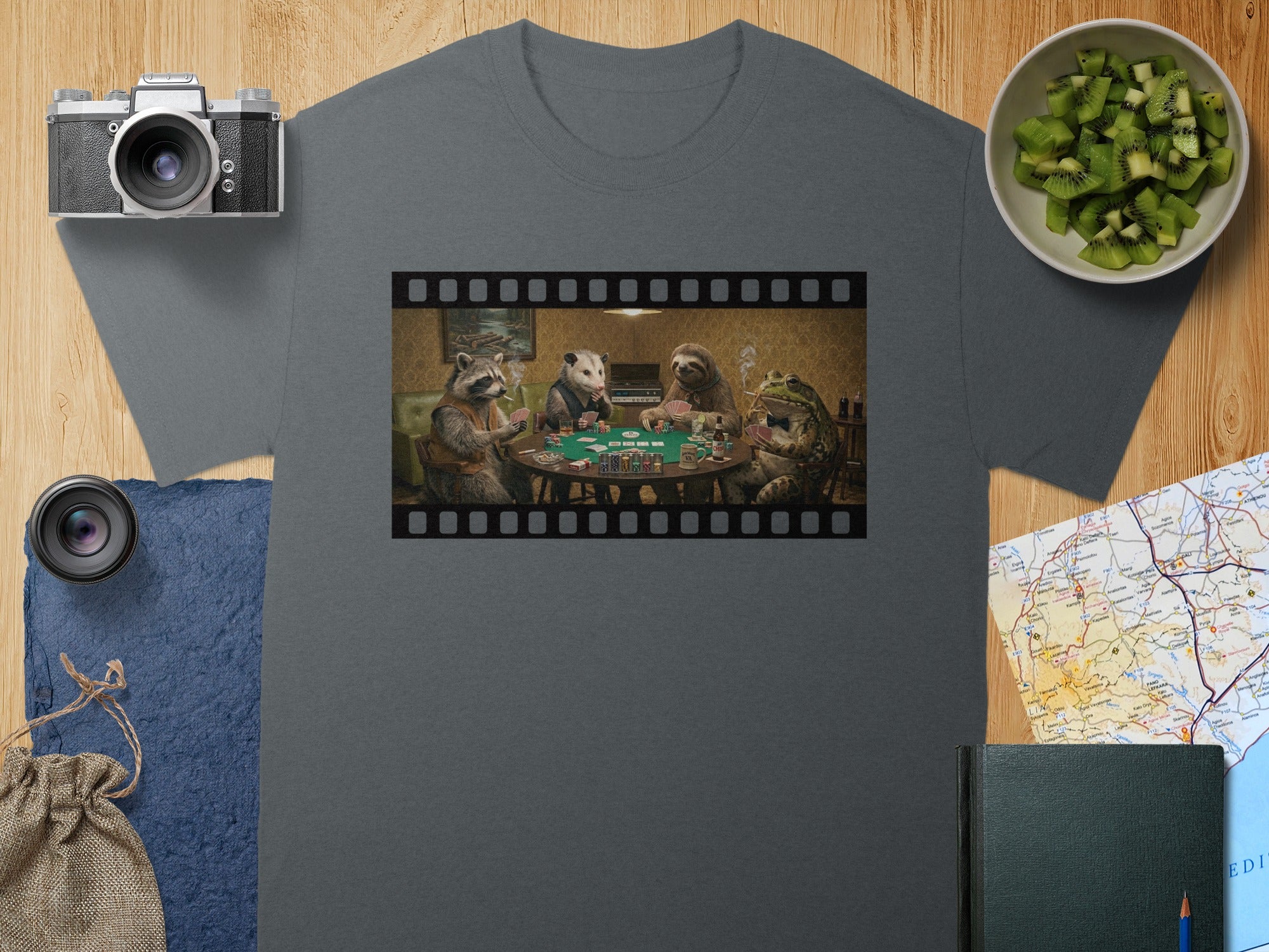 Four animals play poker in a room, with a film strip border.