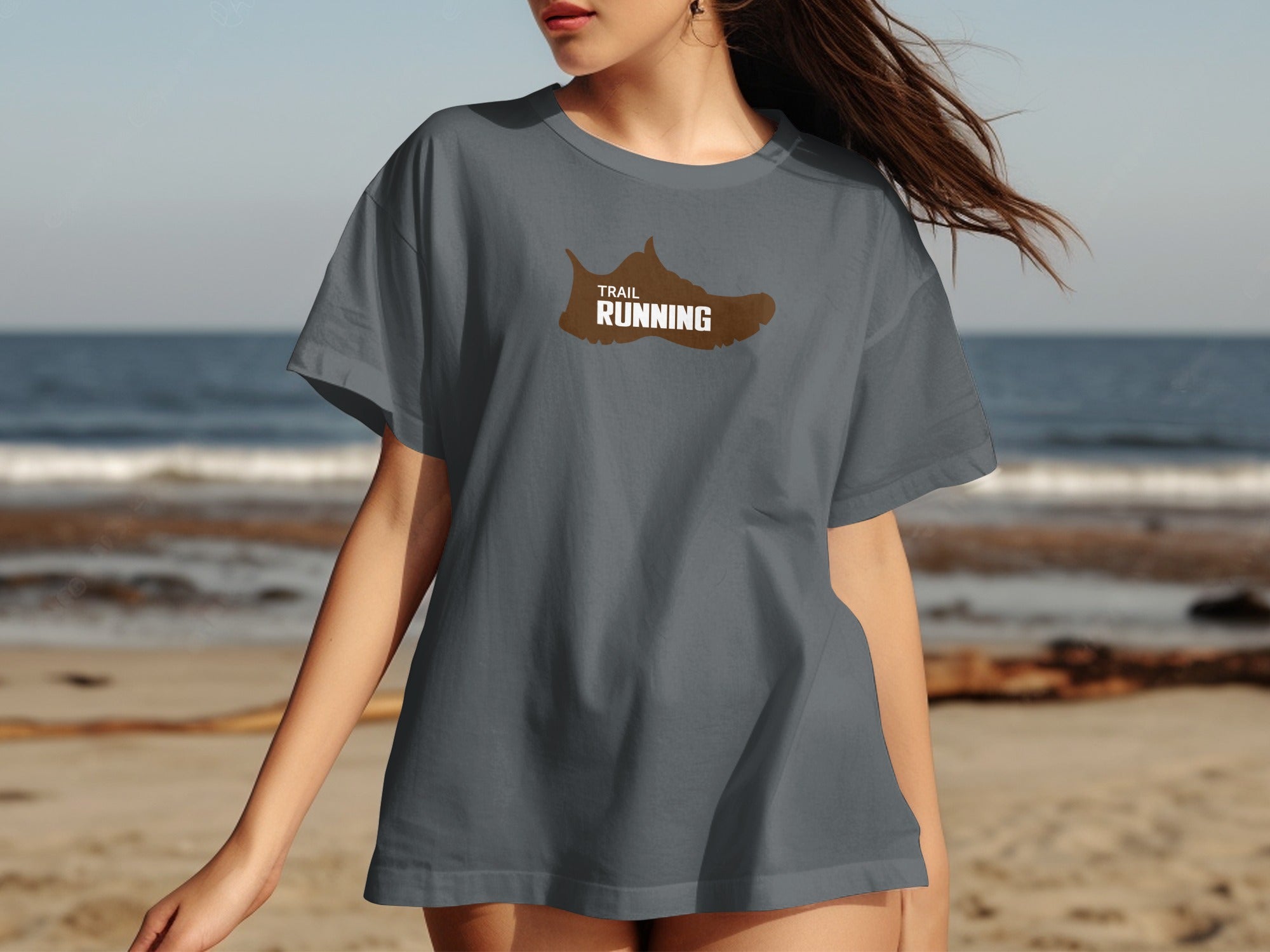 Dark grey t-shirt with a brown trail running shoe graphic and text.