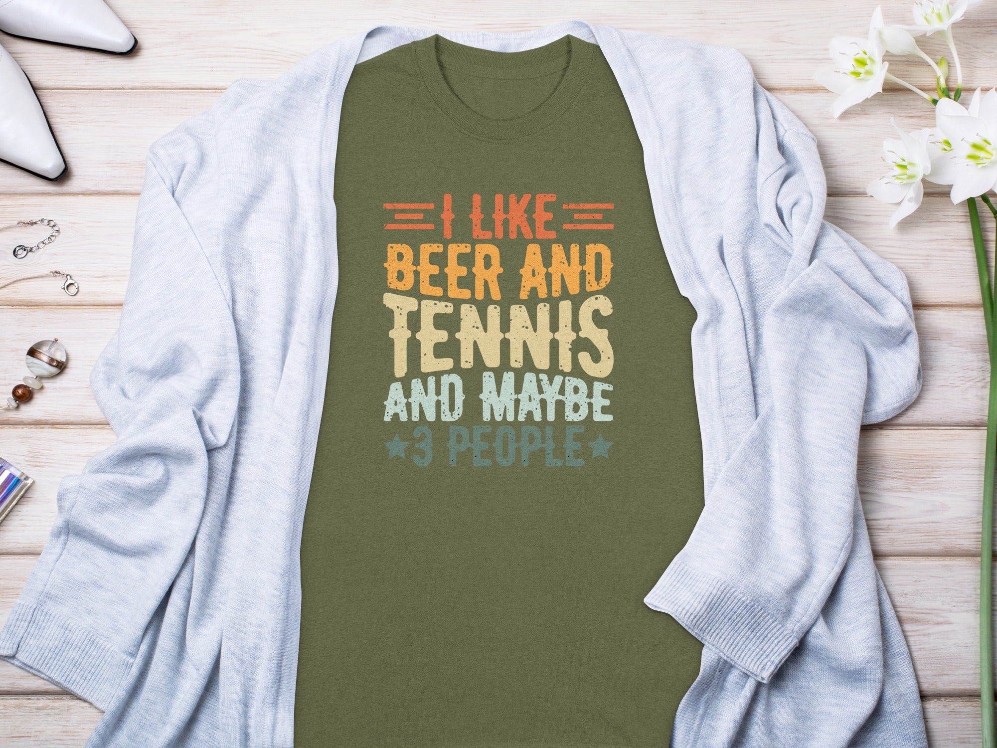 Green t-shirt with text "I like Beer and Tennis and maybe 3 people."