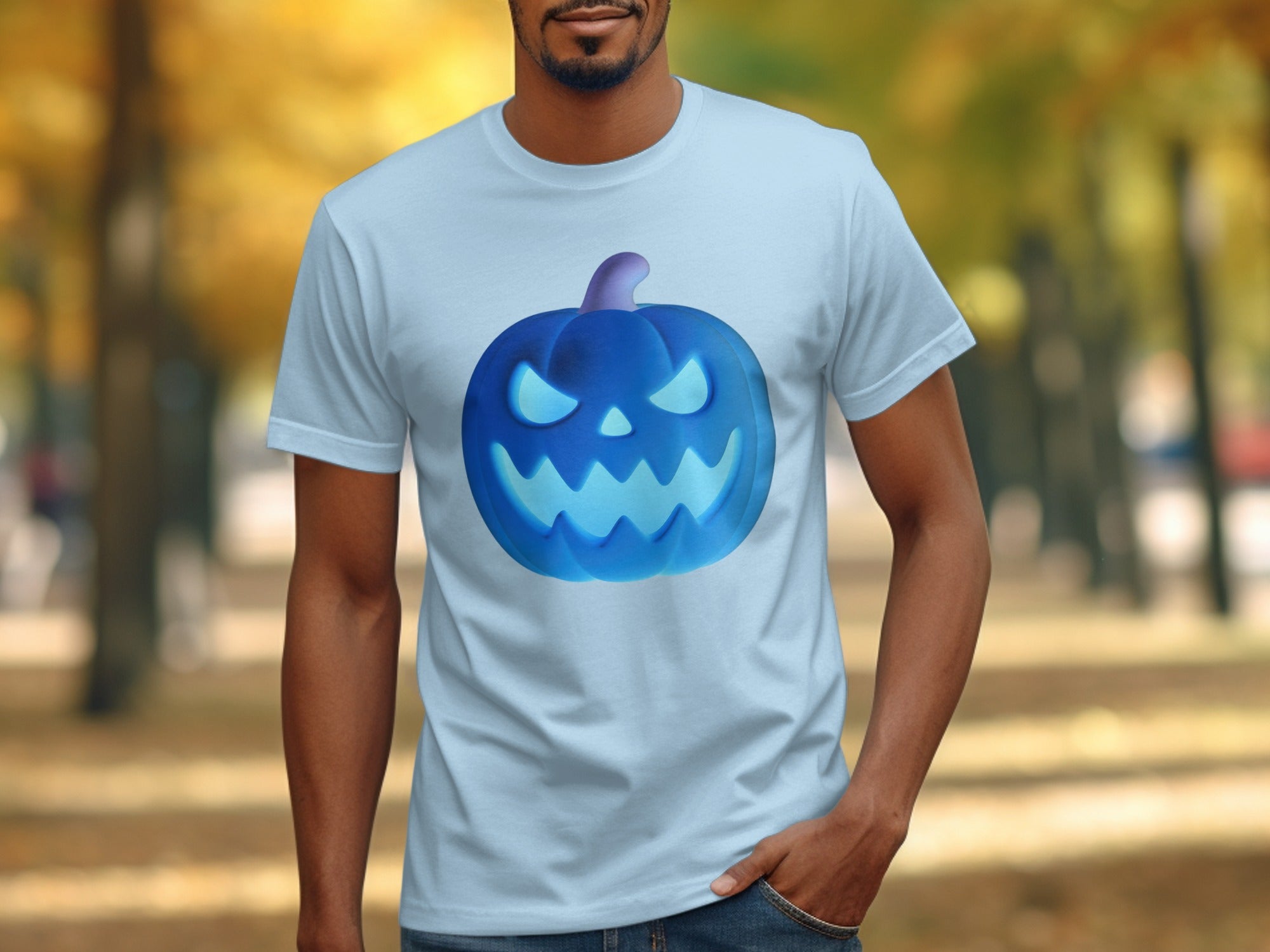 Light blue t-shirt with a glowing blue jack-o'-lantern graphic on the front.