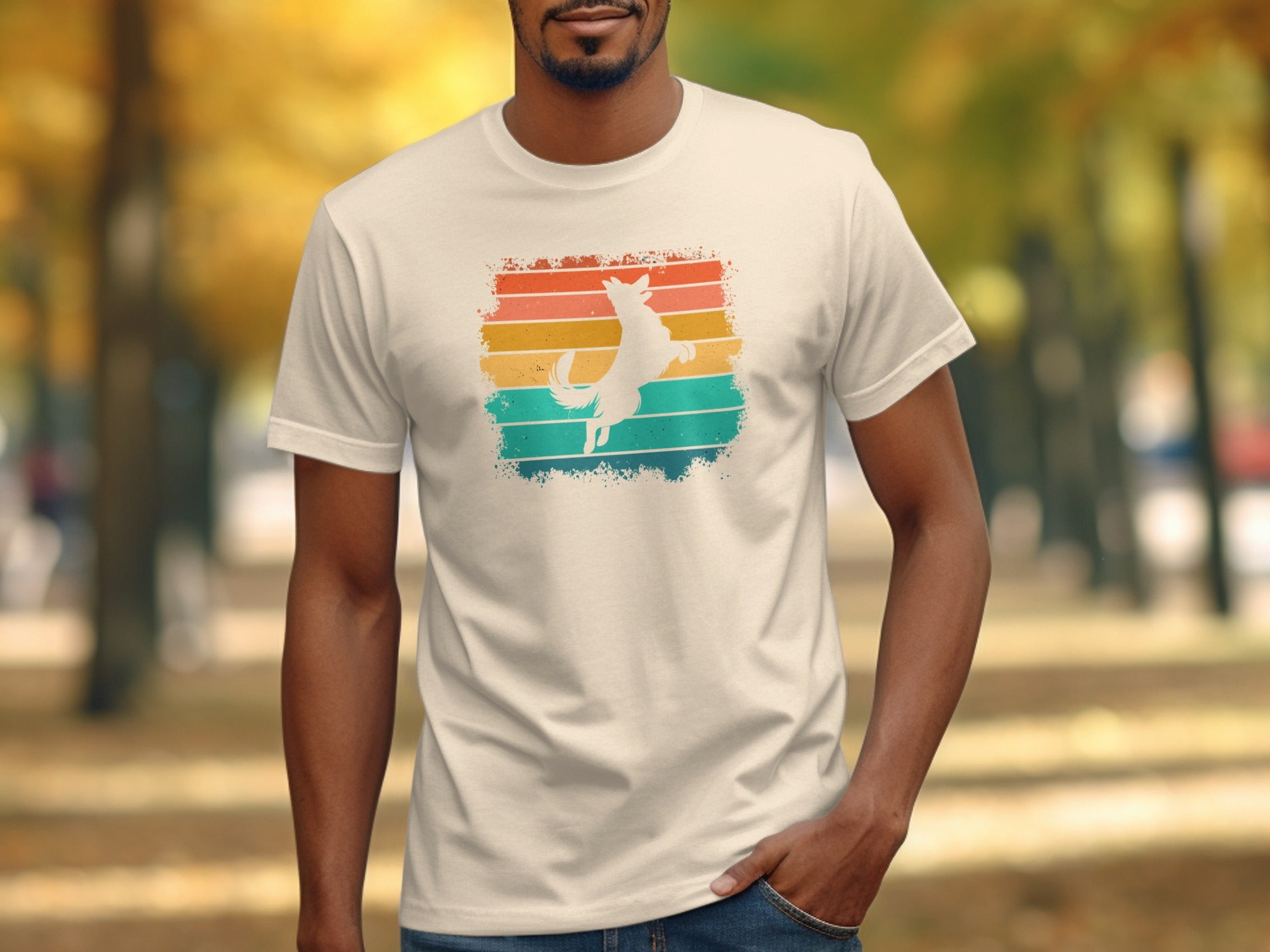 White dog silhouette leaping in front of colorful retro gradient stripes on a t-shirt.