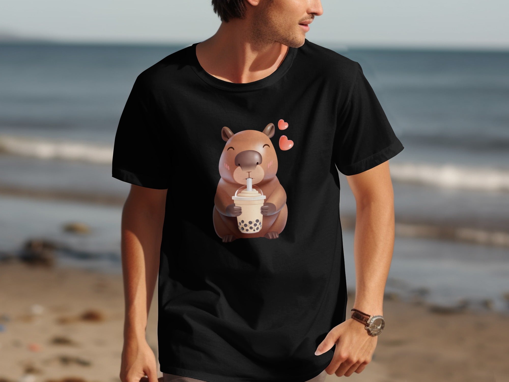 Black t-shirt with a cartoon capybara holding a boba tea with hearts.