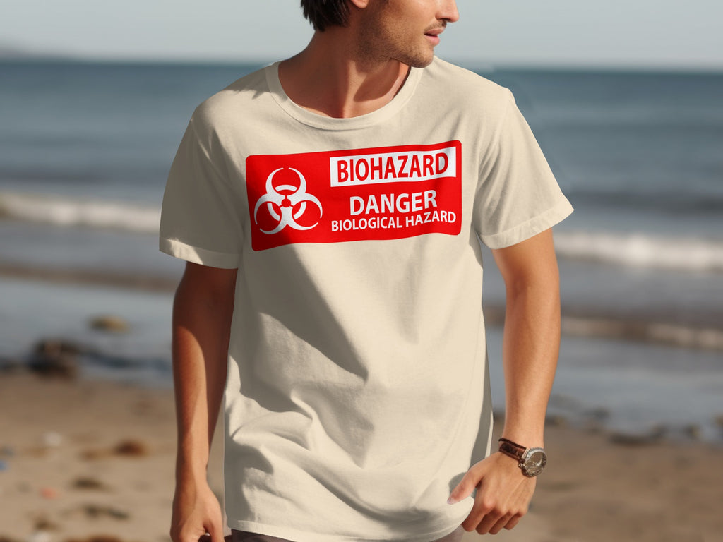 Cream t-shirt with a red biohazard danger biological hazard sign graphic.