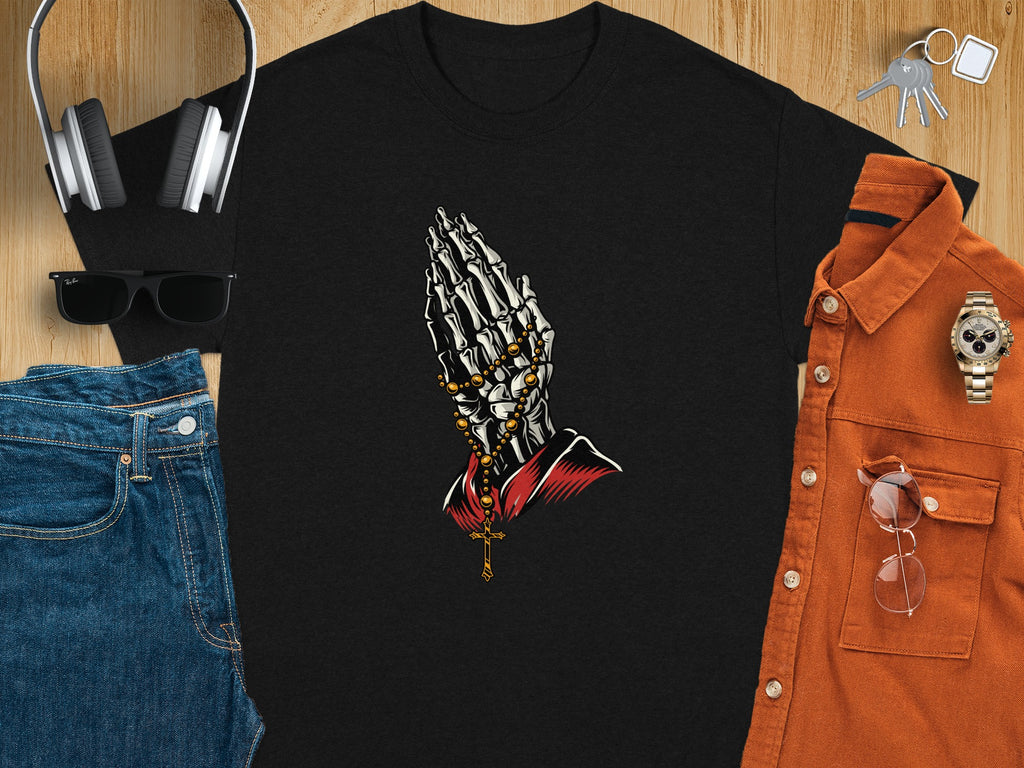 Black t-shirt with graphic of skeleton praying hands and rosary beads.