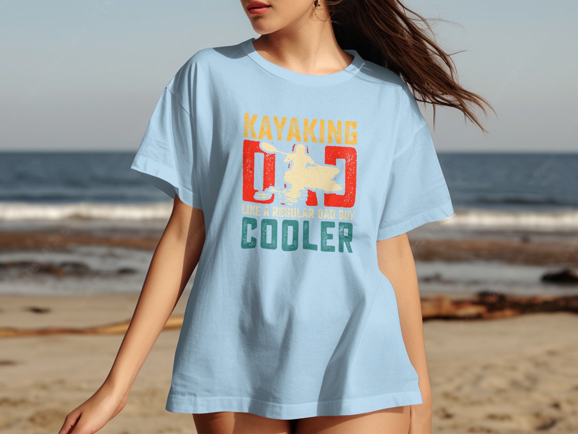 Light blue t-shirt with "Kayaking Dad Like A Regular Dad But Cooler" text and graphic.