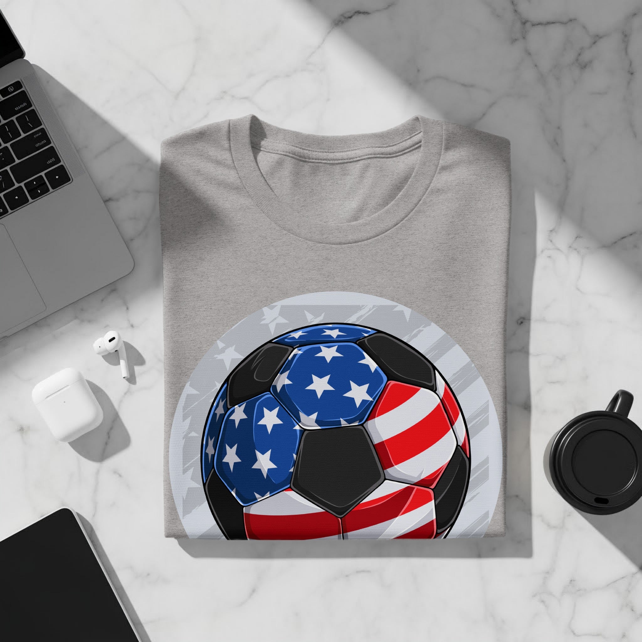 Grey t-shirt with a soccer ball graphic featuring the American flag design.