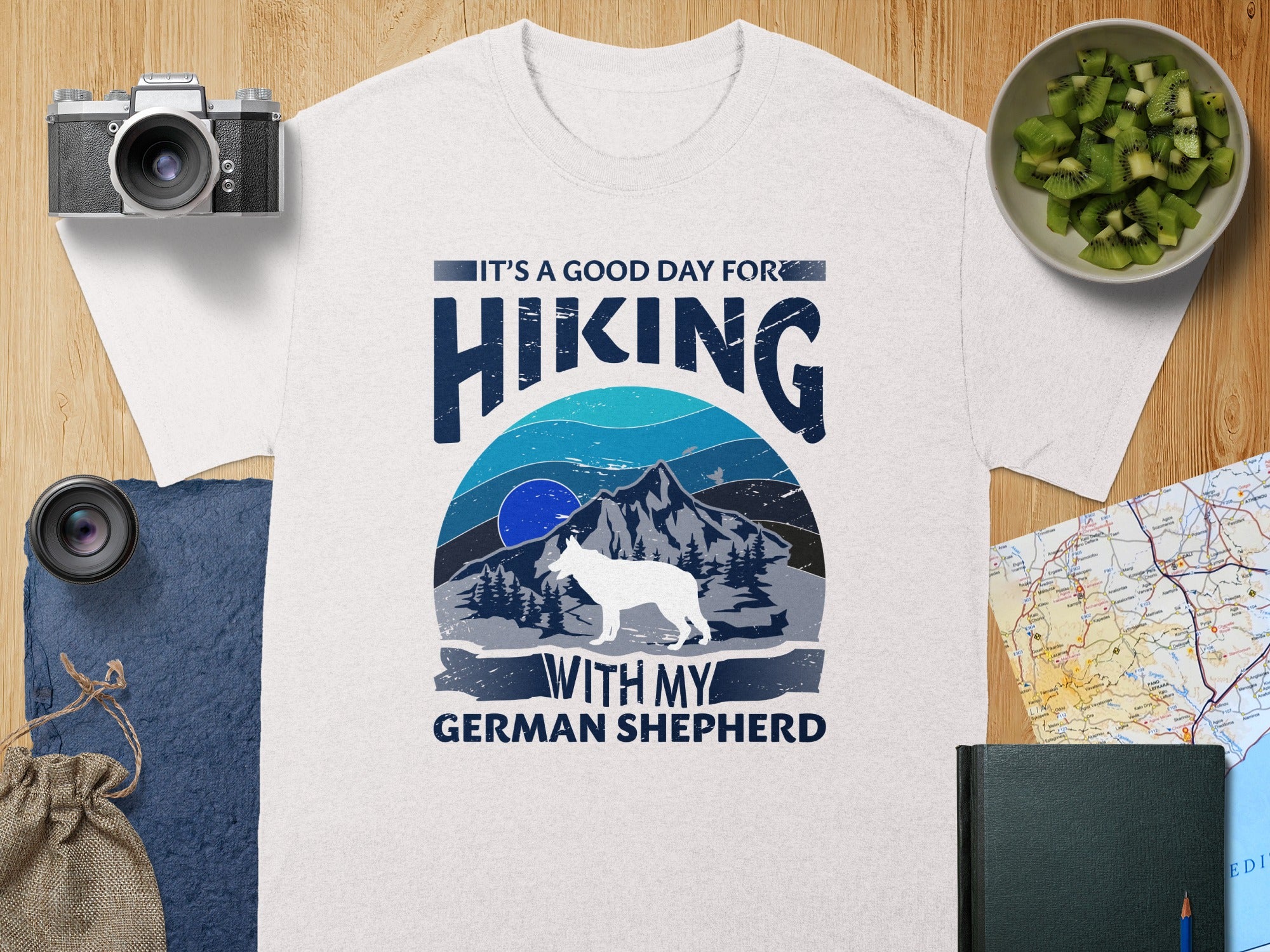 T-shirt design with "It's a good day for hiking with my German Shepherd."