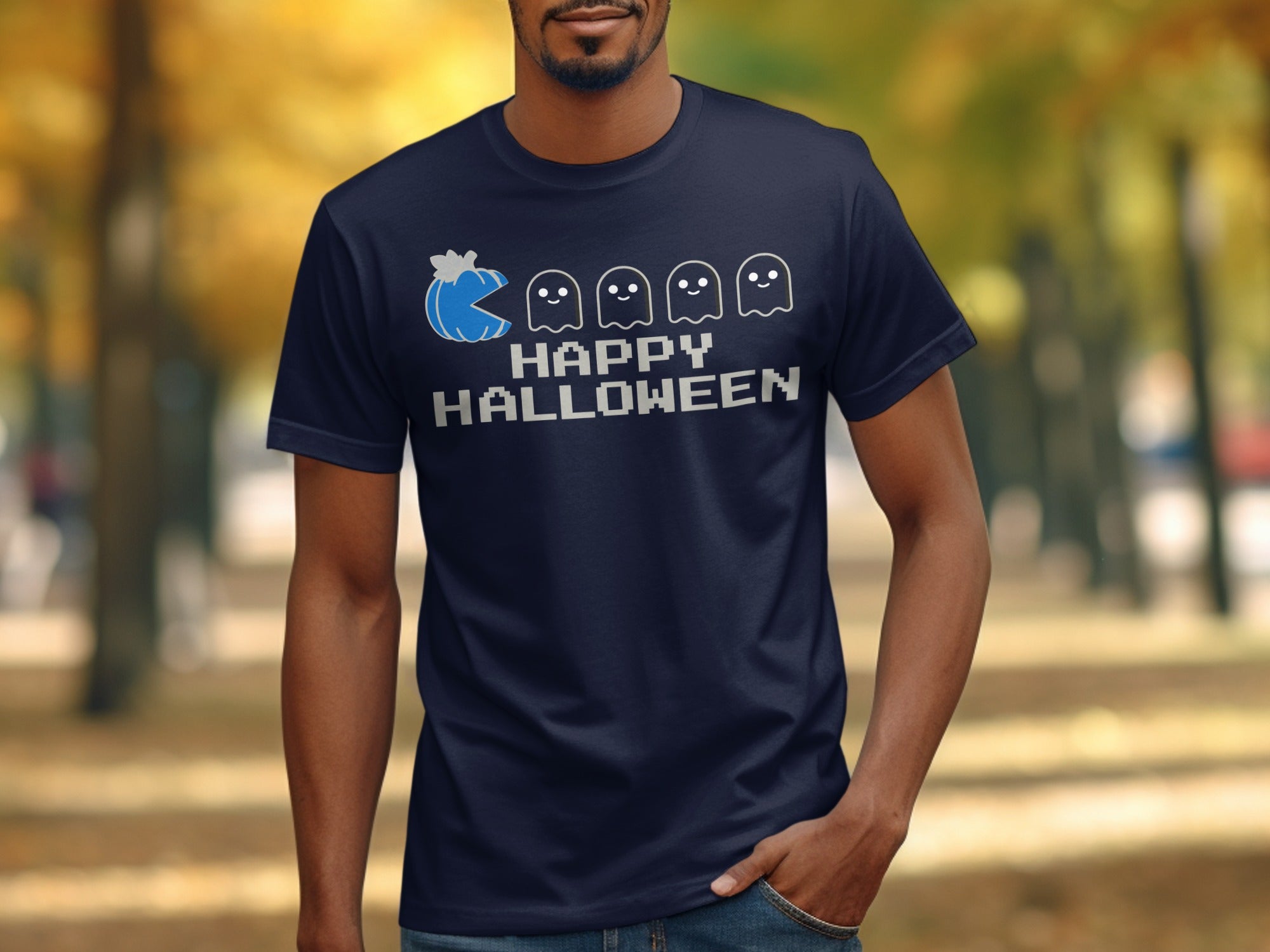 Blue pumpkin Pac-Man chasing ghosts on a navy t-shirt with "HAPPY HALLOWEEN" text.