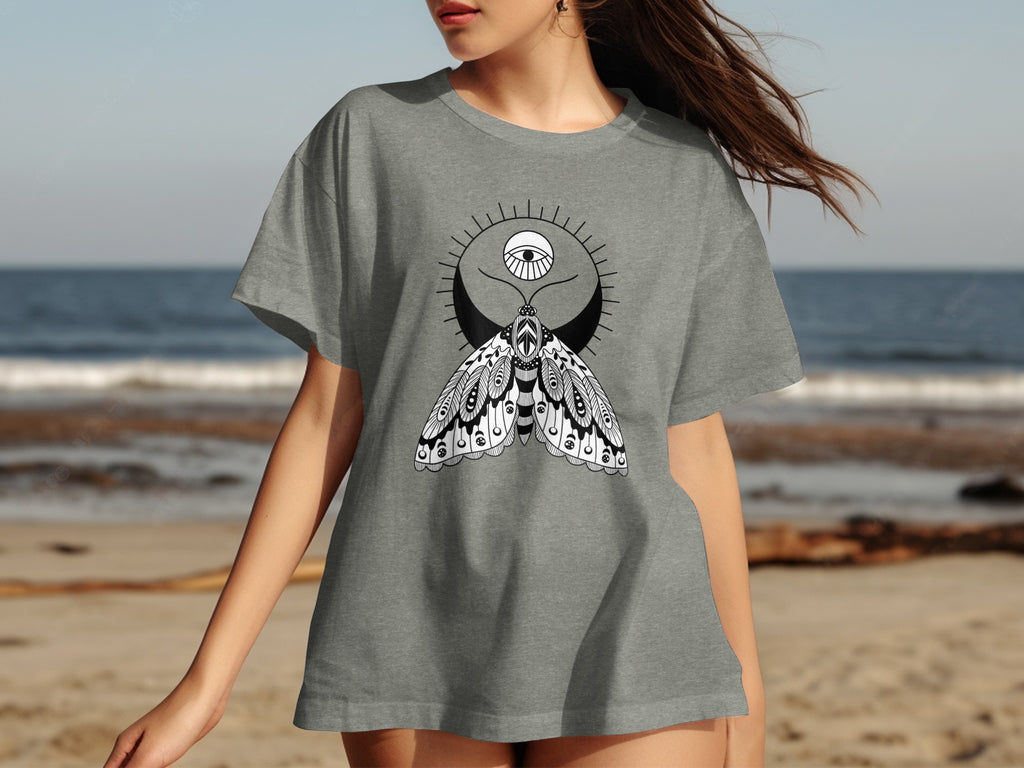 Grey t-shirt with a black and white moth design and celestial elements.