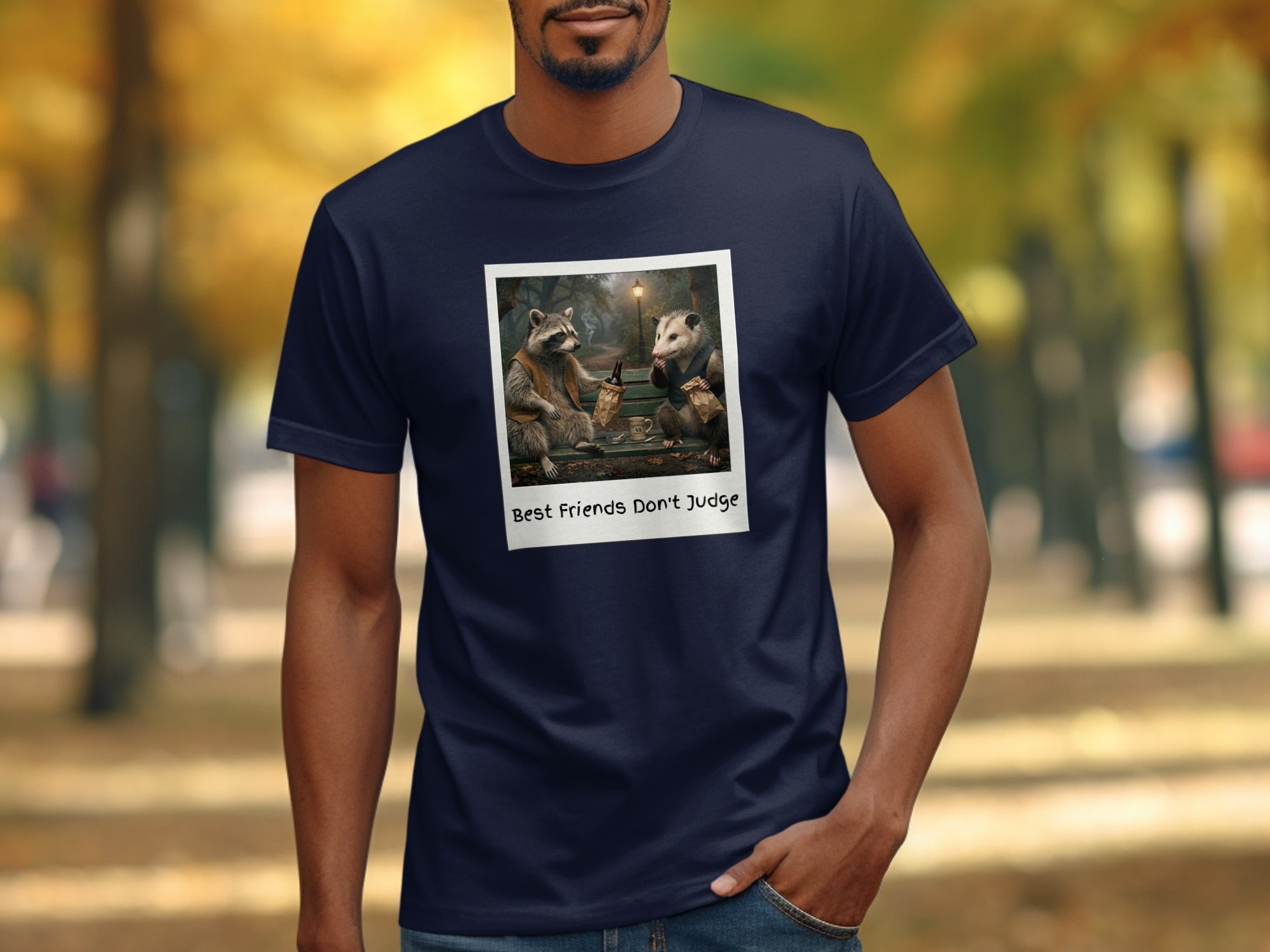 T-shirt with polaroid of raccoon and possum sharing drinks with text "Best Friends Don't Judge".