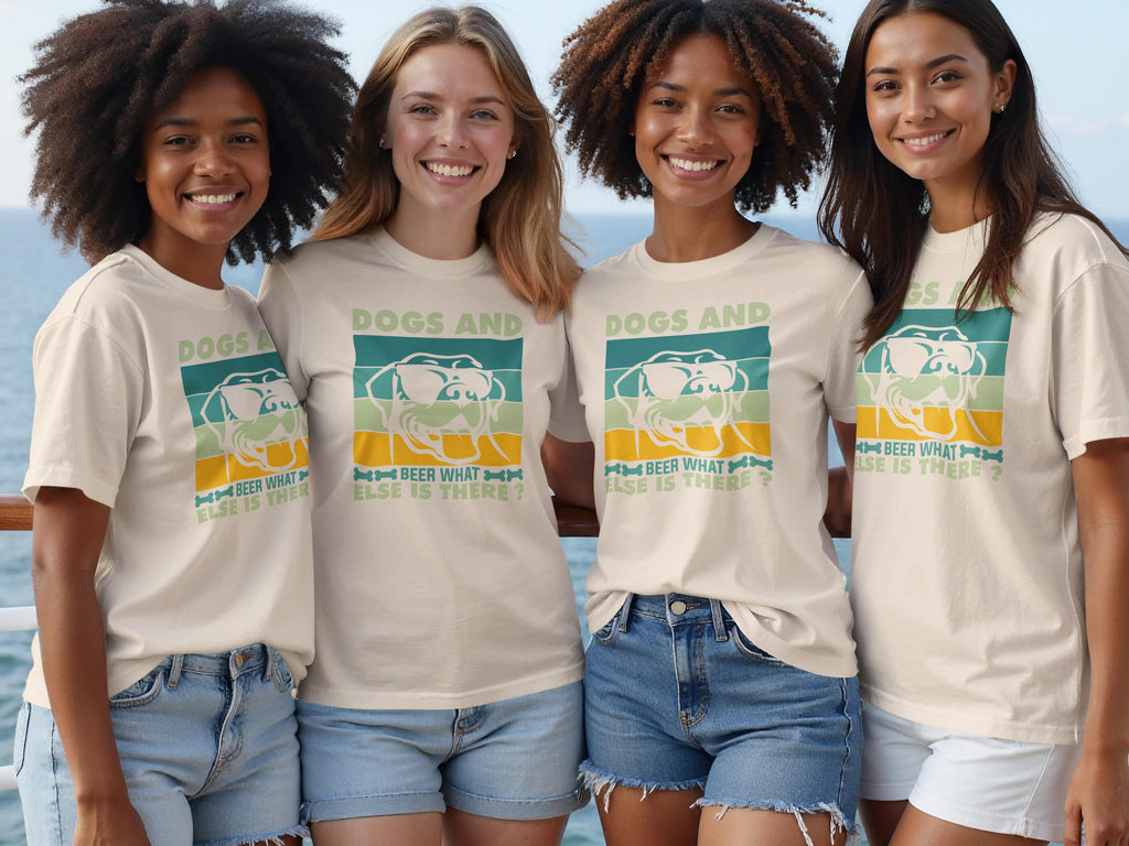 Four women smile, wearing tan t-shirts with the text "Dogs and beer, what else is there?"
