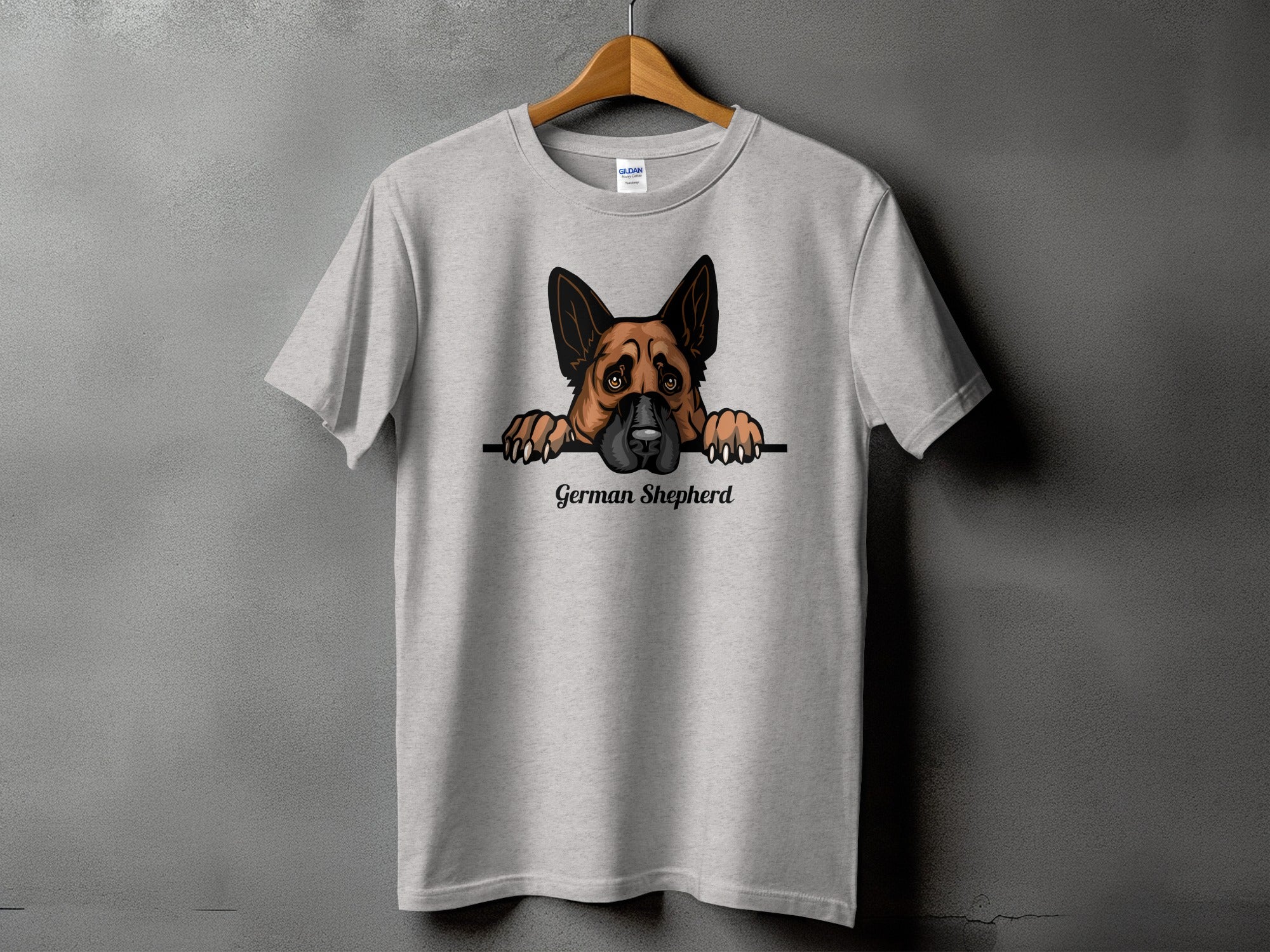 Grey t-shirt with a German Shepherd peeking over a line.