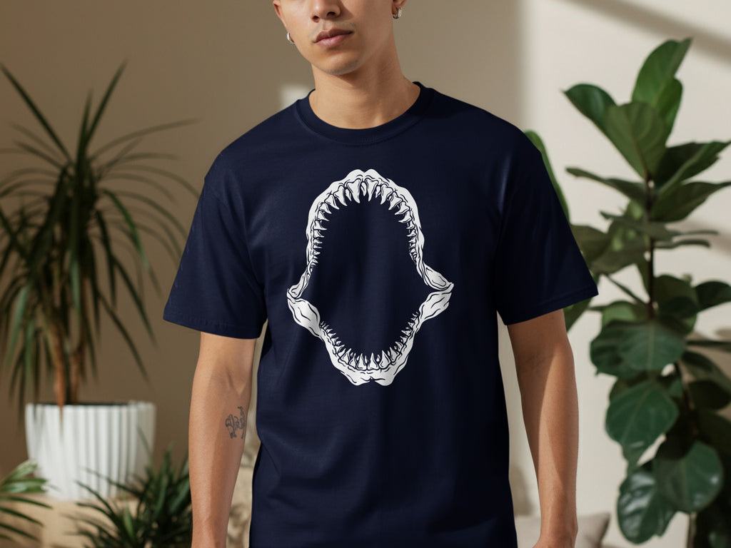 Navy t-shirt with white shark jaw graphic on the chest.