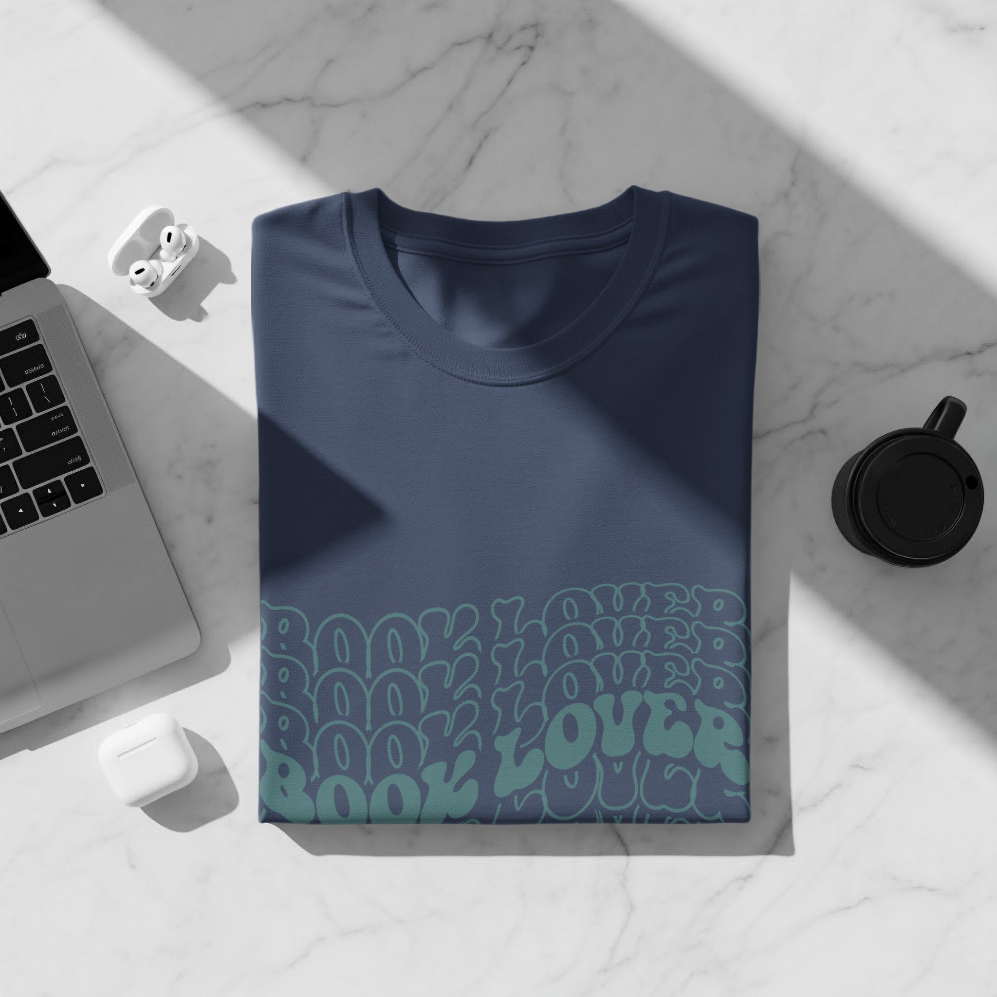 Dark blue t-shirt with repeating "Book Lover" pattern in teal.