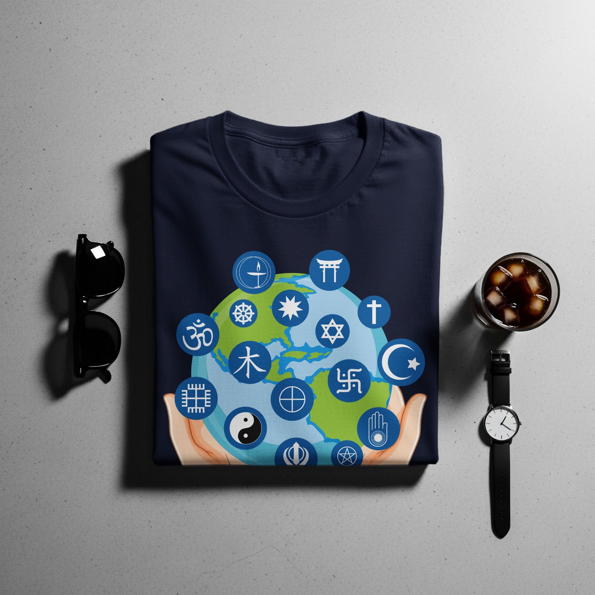 T-shirt with Earth surrounded by religious symbols held by hands.