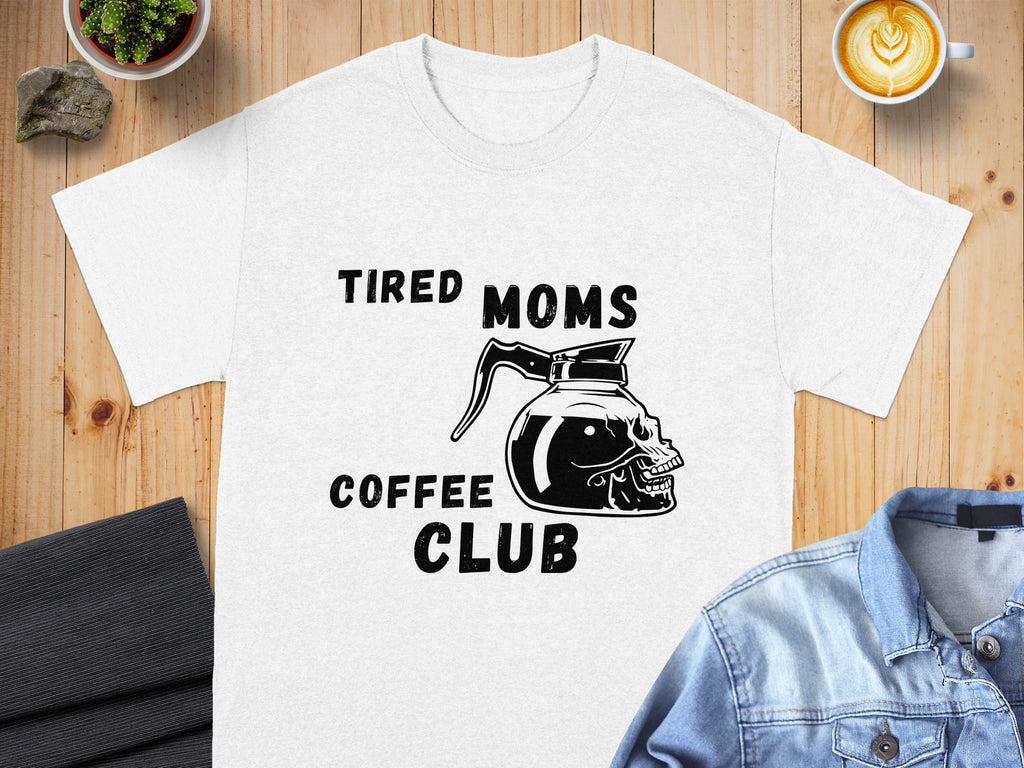 White t-shirt with black text and a coffee pot skull graphic reading "TIRED MOMS COFFEE CLUB".