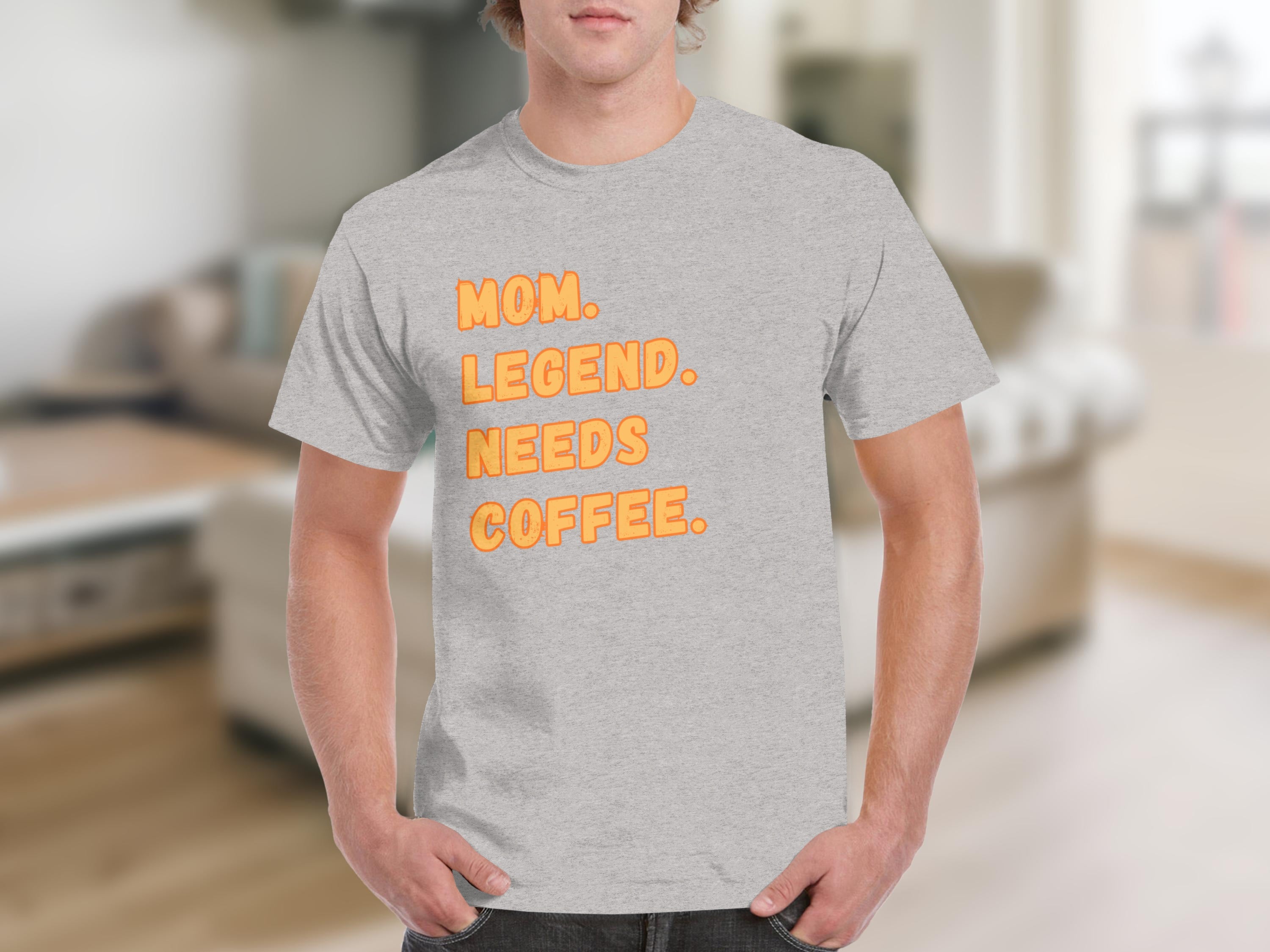 Grey t-shirt with orange text: Mom. Legend. Needs. Coffee.