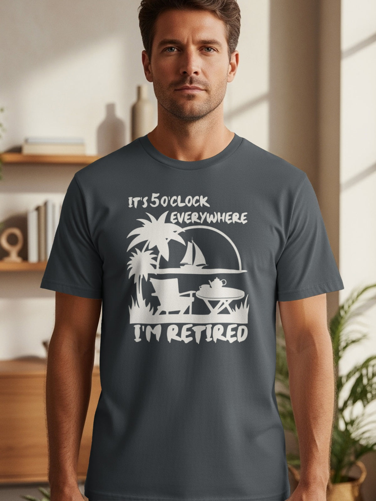 Dark grey t-shirt with white text and graphics: "IT'S 5 O'CLOCK EVERYWHERE I'M RETIRED."