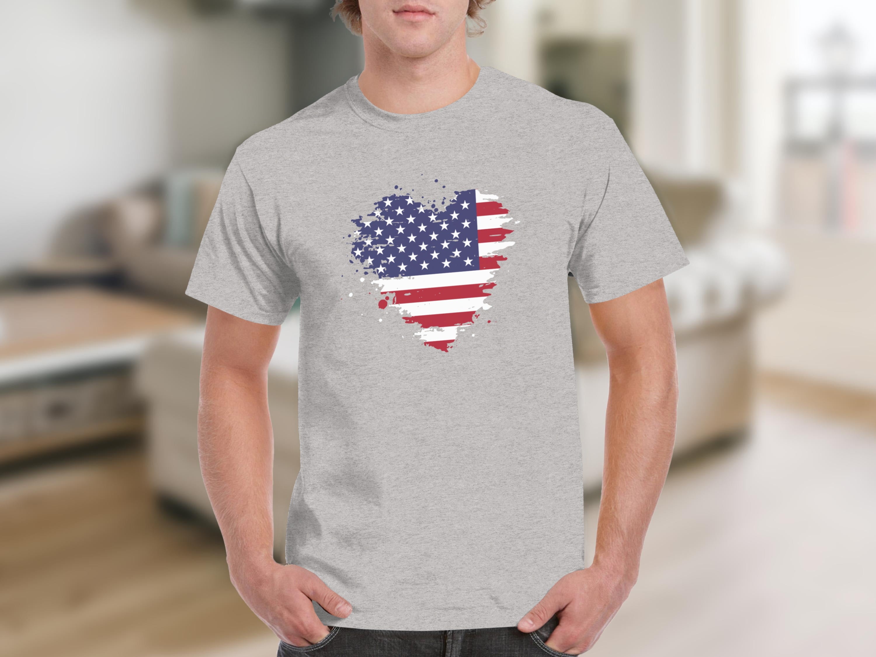 Man wearing a gray t-shirt with a distressed American flag heart graphic.