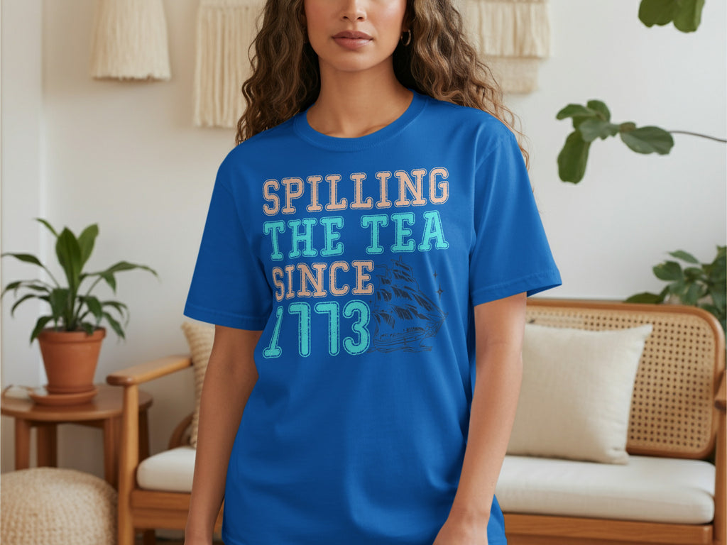 Blue t-shirt with "Spilling The Tea Since 1773" and a ship graphic.