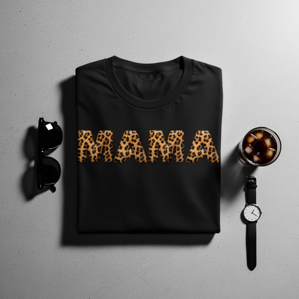 Black t-shirt with leopard print "MAMA" graphic, sunglasses, and watch.