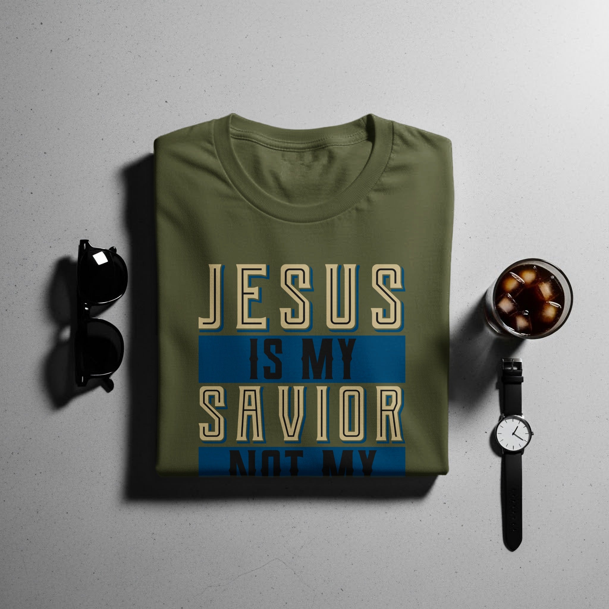 Olive green t-shirt with "JESUS IS MY SAVIOR NOT MY" text.