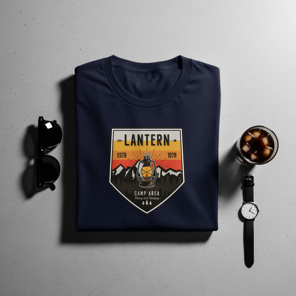 Navy t-shirt with a vintage lantern graphic and "Camp Area" text.