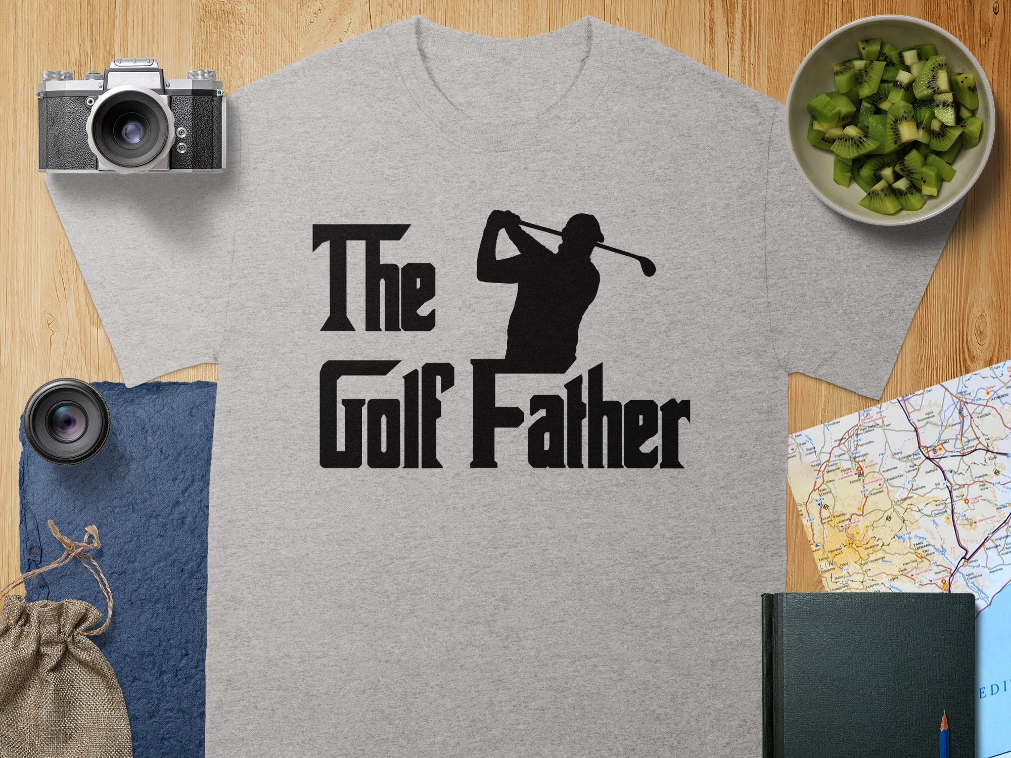 Grey t-shirt with "The Golf Father" text and golfer silhouette graphic.