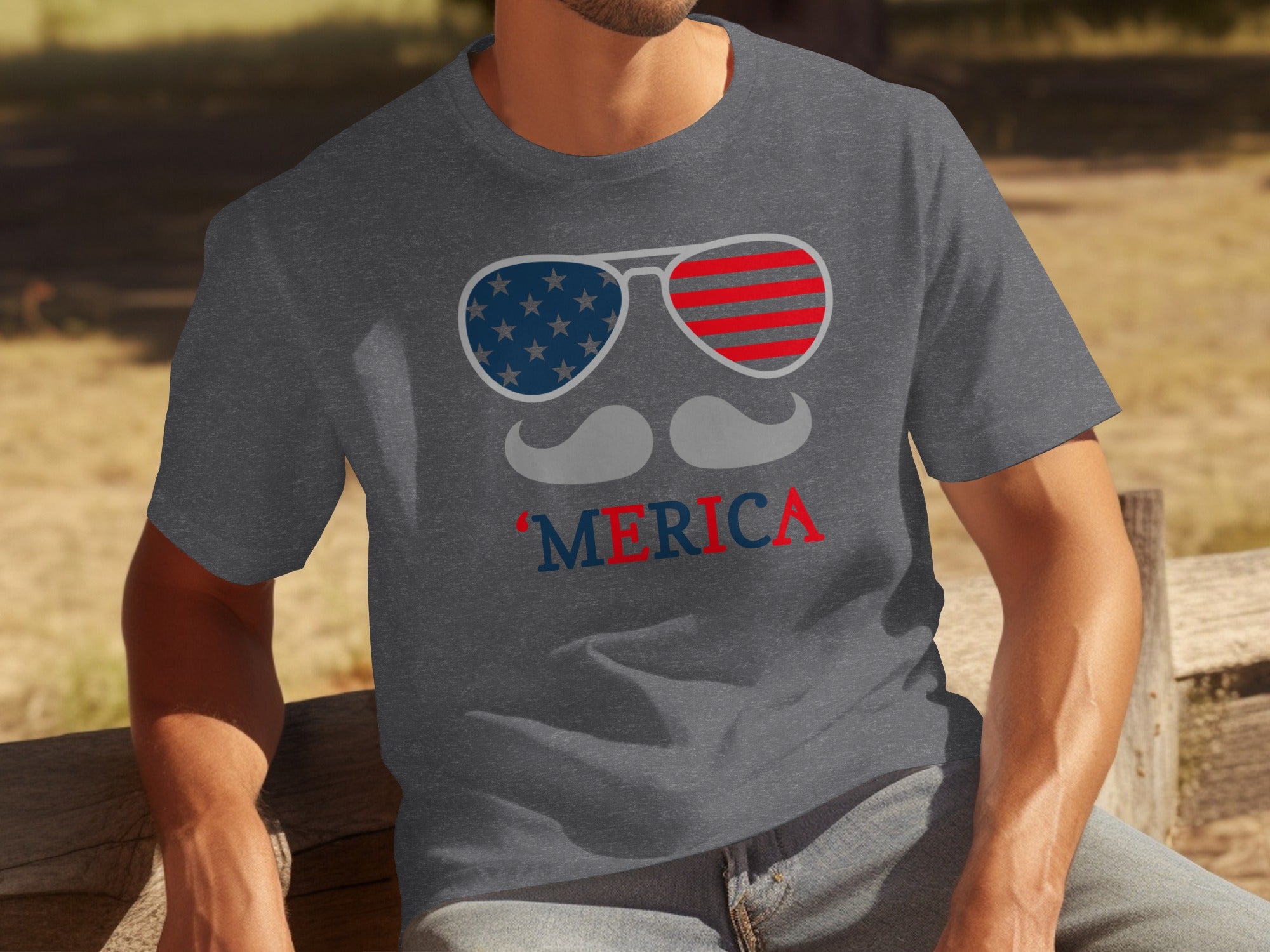 Grey t-shirt with American flag sunglasses, mustache, and "Merica" text.