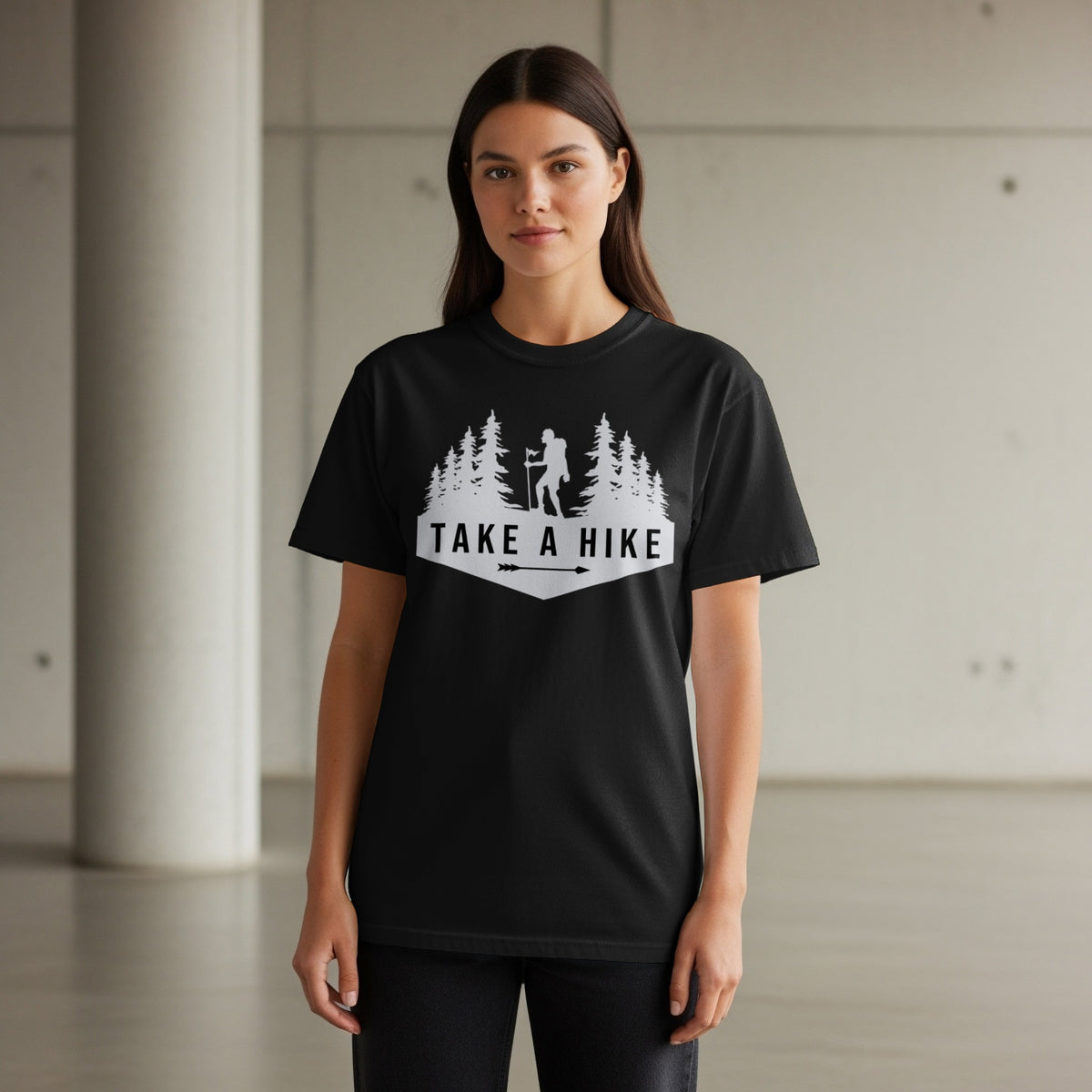 Black t-shirt with white "Take a Hike" text, hiker, and trees graphic.
