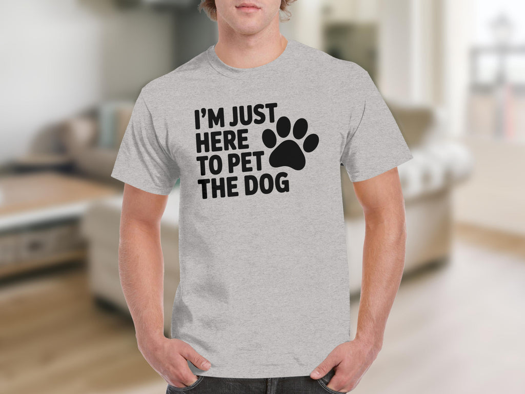 Light grey t-shirt with black text "I'M JUST HERE TO PET THE DOG" and a paw print.
