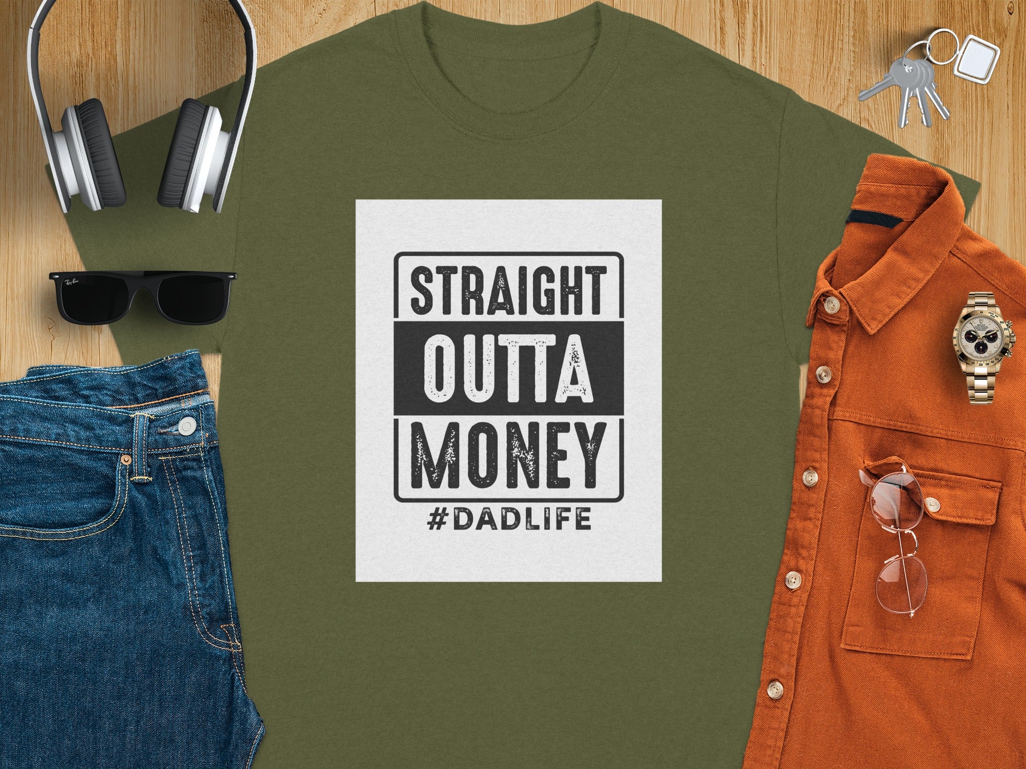 Green t-shirt with text "STRAIGHT OUTTA MONEY #DADLIFE".