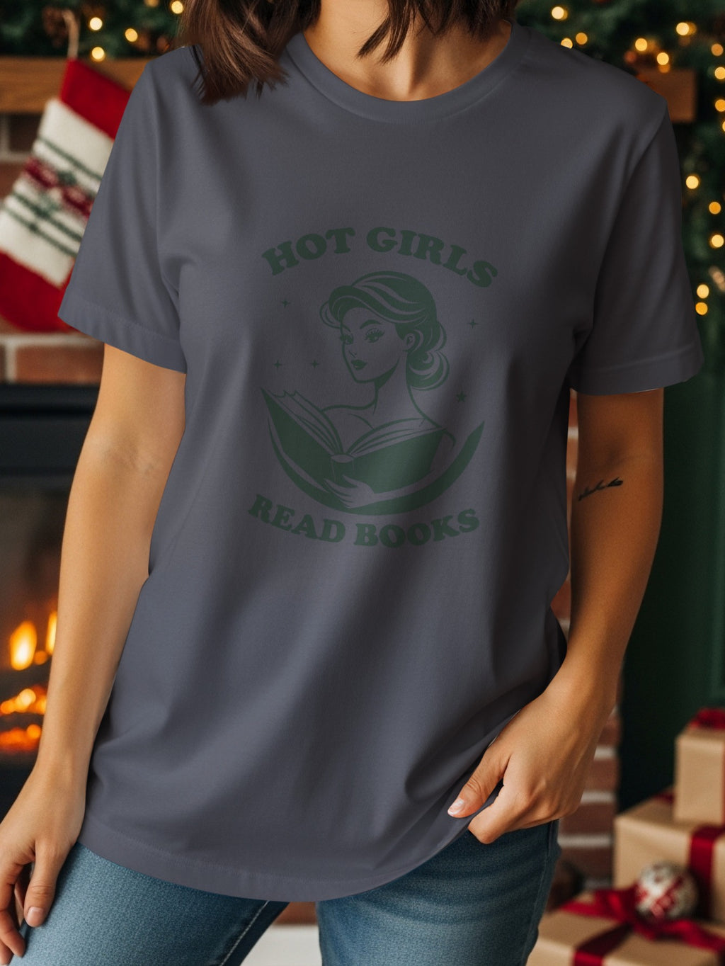 Dark gray t-shirt with green graphic of a woman reading a book and text "HOT GIRLS READ BOOKS".