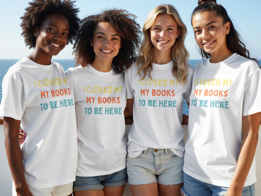 Four women wear white t-shirts with "I CLOSED MY MY BOOKS TO BE HERE" text.