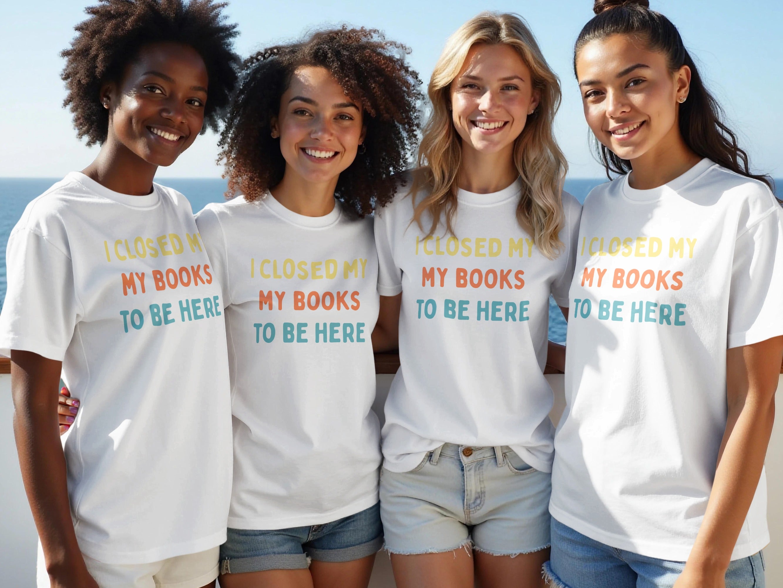 Four women wear white t-shirts with "I CLOSED MY MY BOOKS TO BE HERE" text.