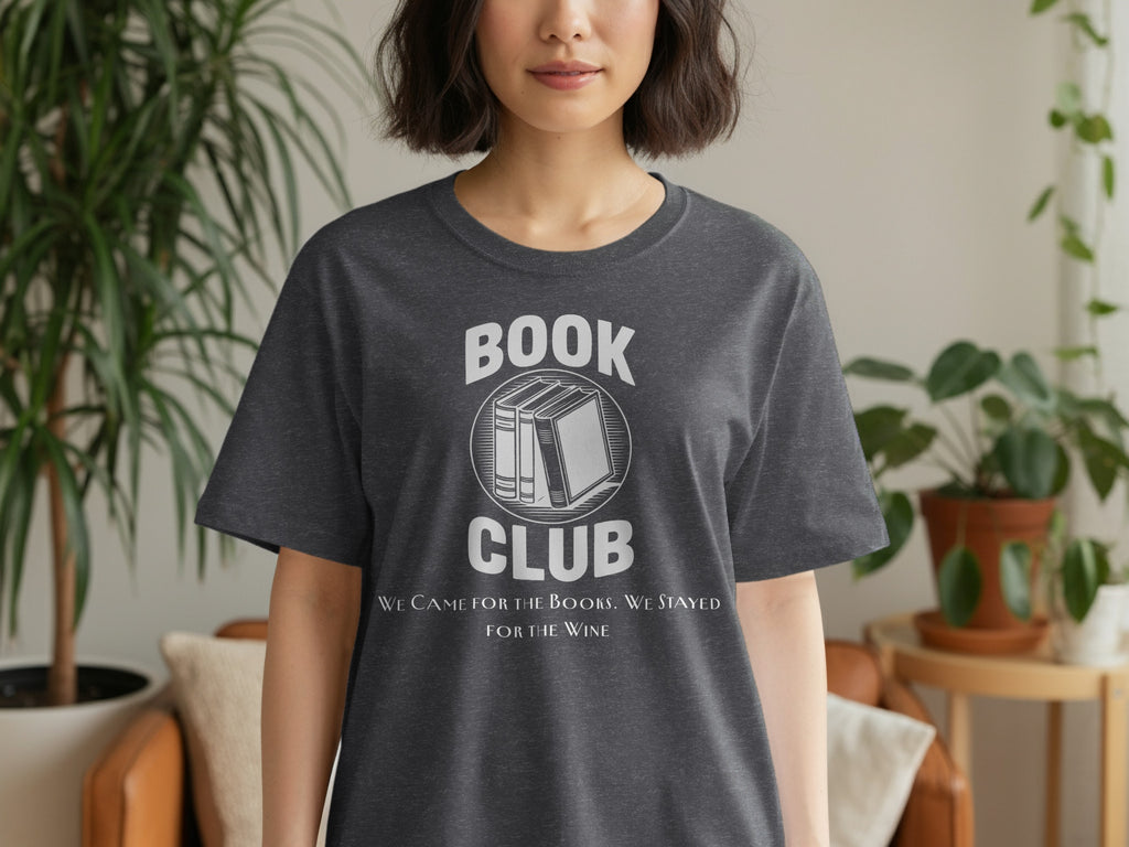 Dark grey t-shirt with a distressed print that says "BOOK CLUB" above stacked books and "WE CAME FOR THE BOOKS. WE STAYED FOR THE WINE."