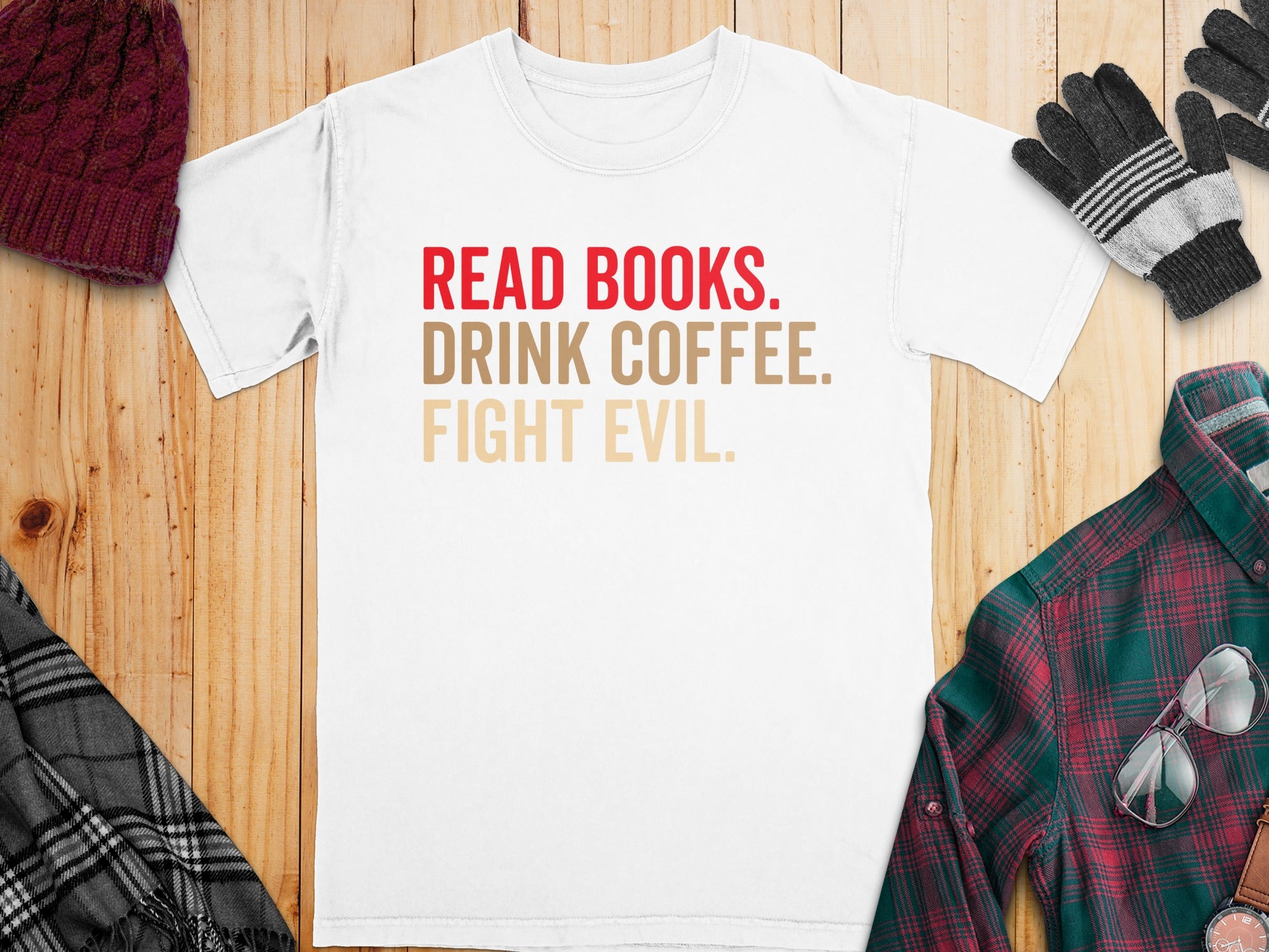 White t-shirt with "Read Books. Drink Coffee. Fight Evil." text in red and tan.