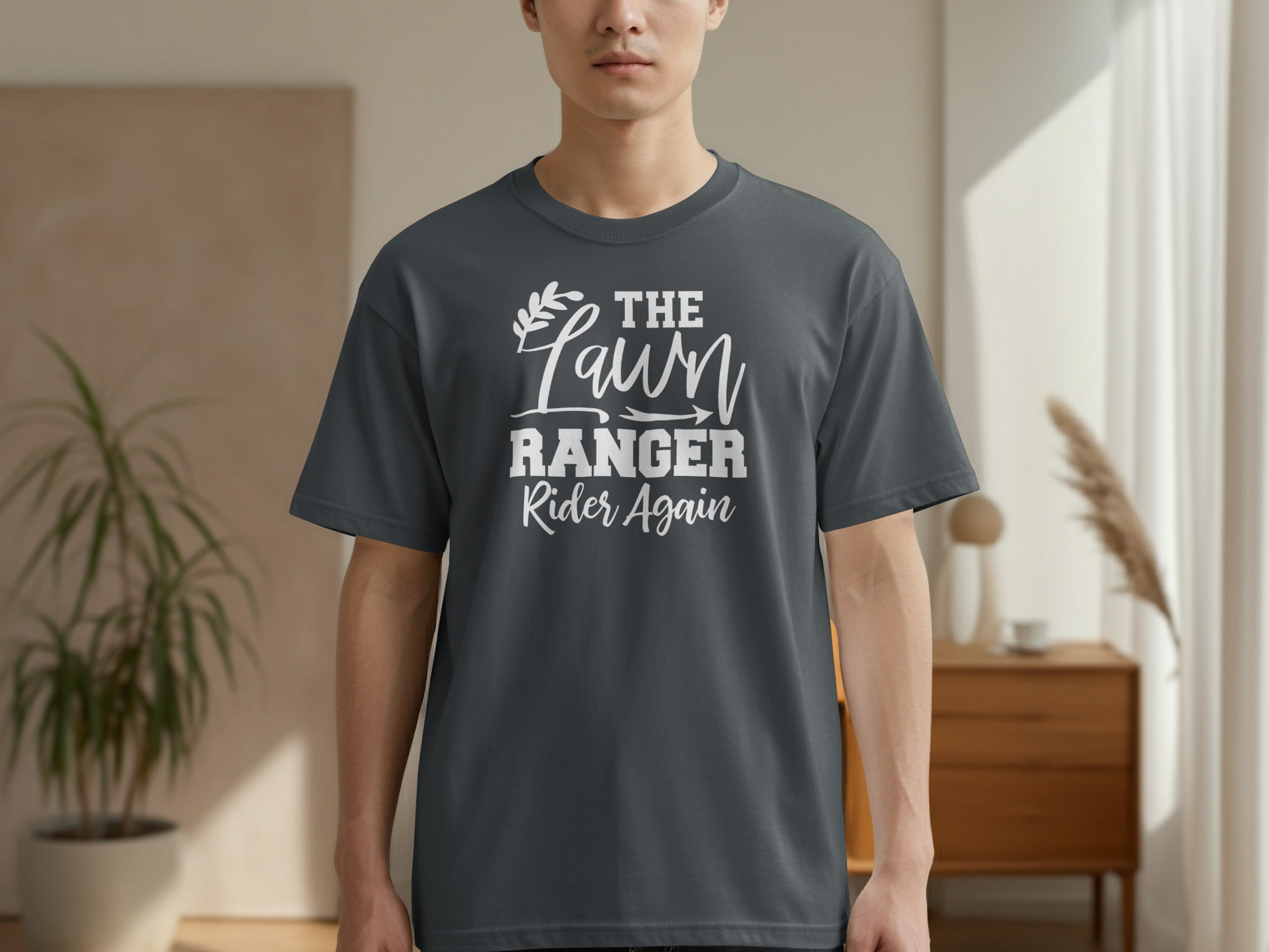 Dark grey t-shirt with white text "THE Lawn RANGER Rider Again".
