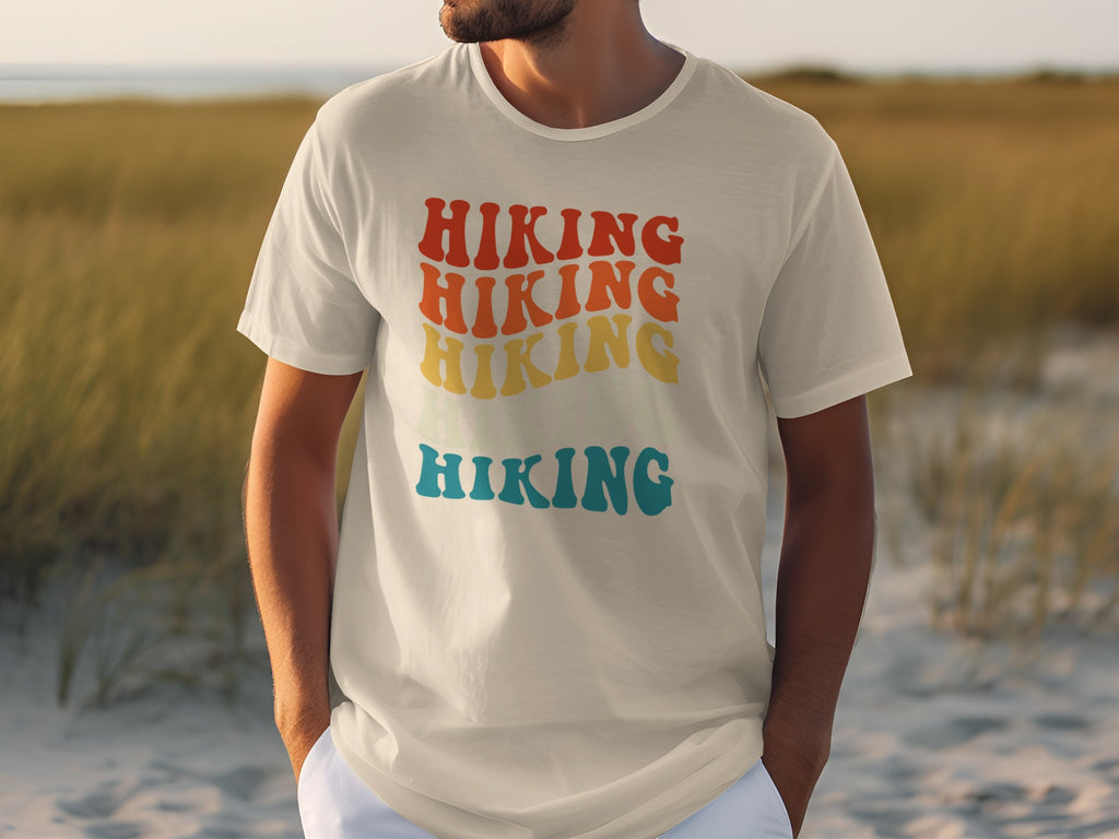 White t-shirt with stacked text of "HIKING" in red, orange, yellow, and blue.