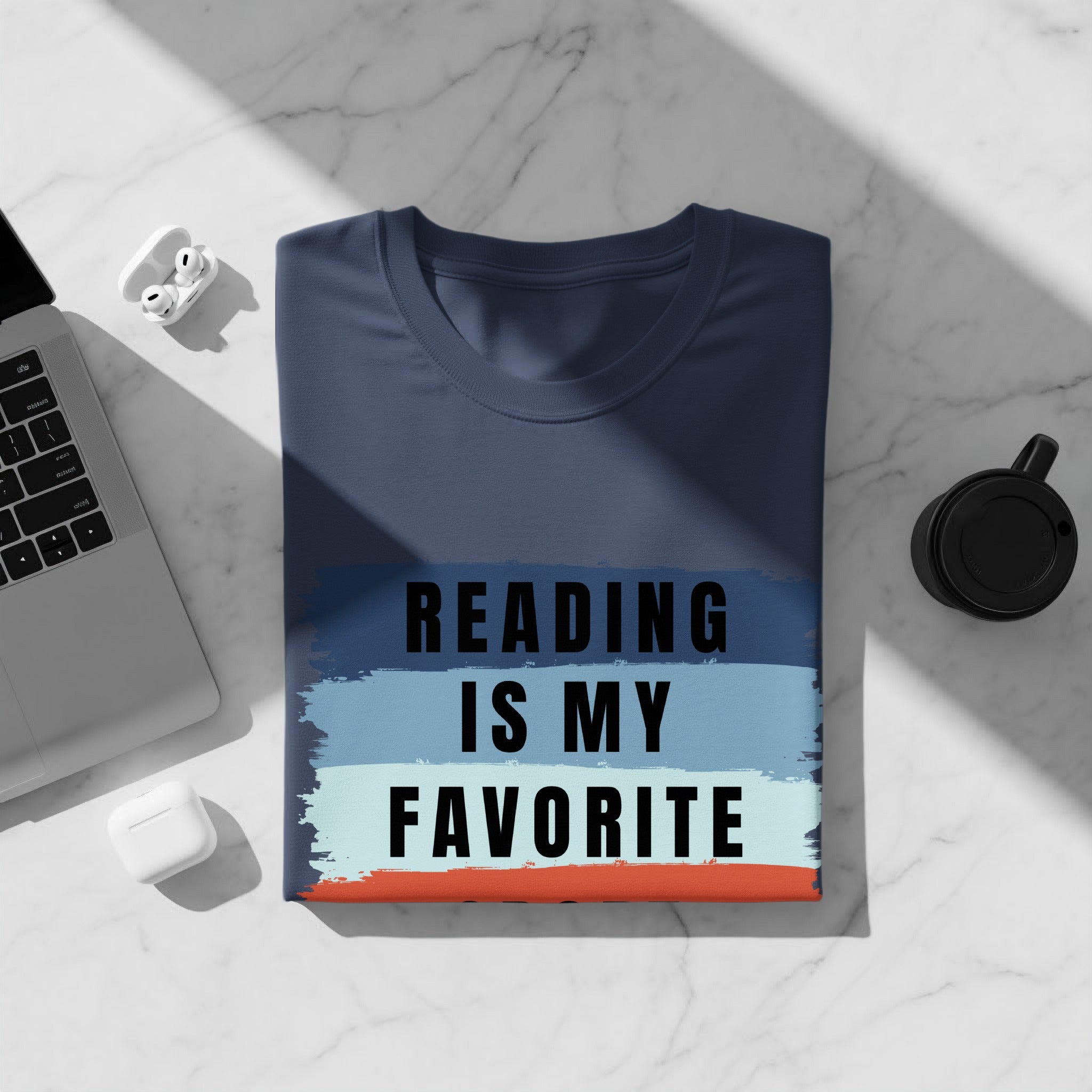 Navy t-shirt with "Reading Is My Favorite" text over striped background.