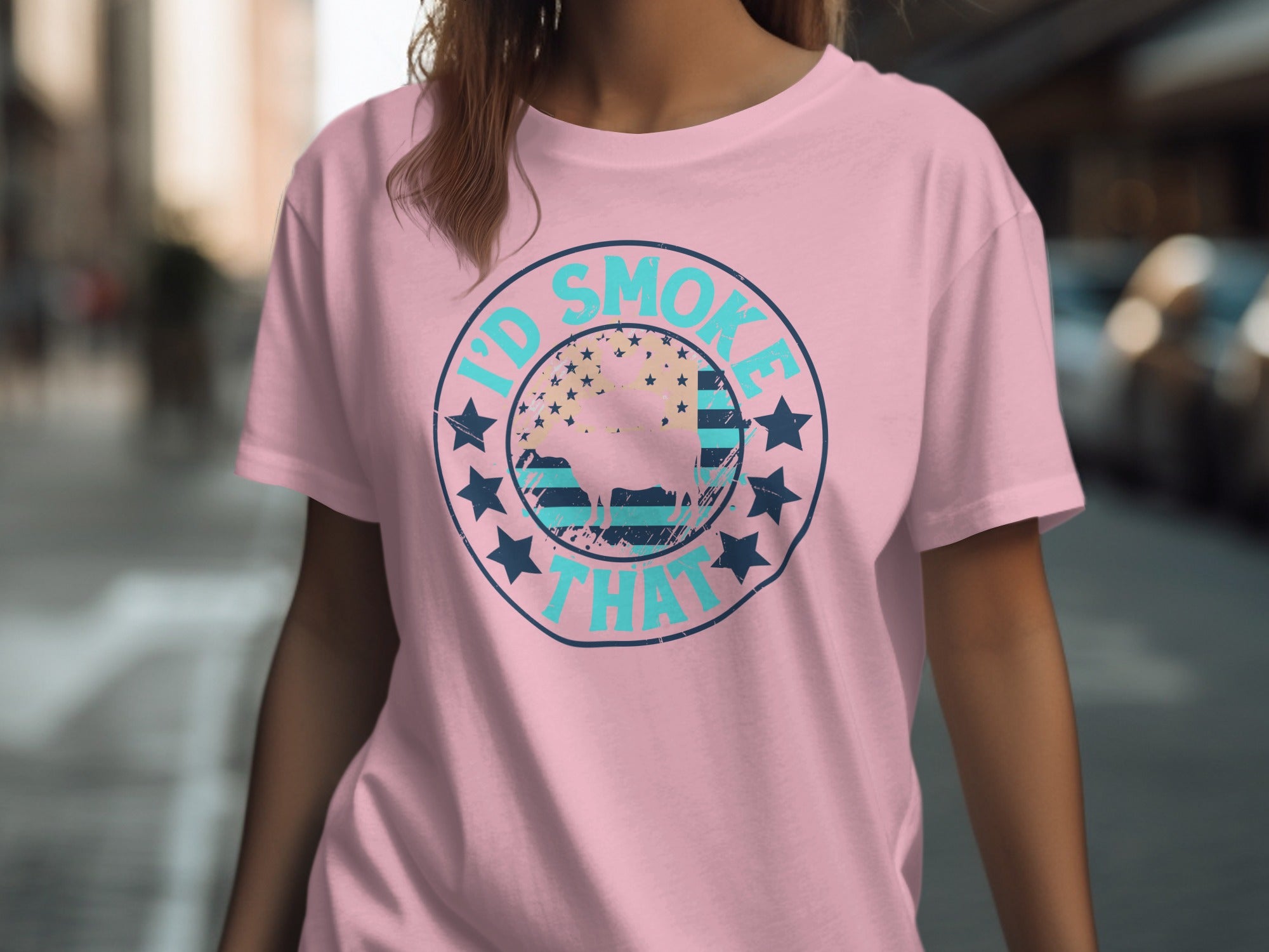 Pink t-shirt with a circular graphic that reads "I'd SMOKE THAT" around a bull silhouette.