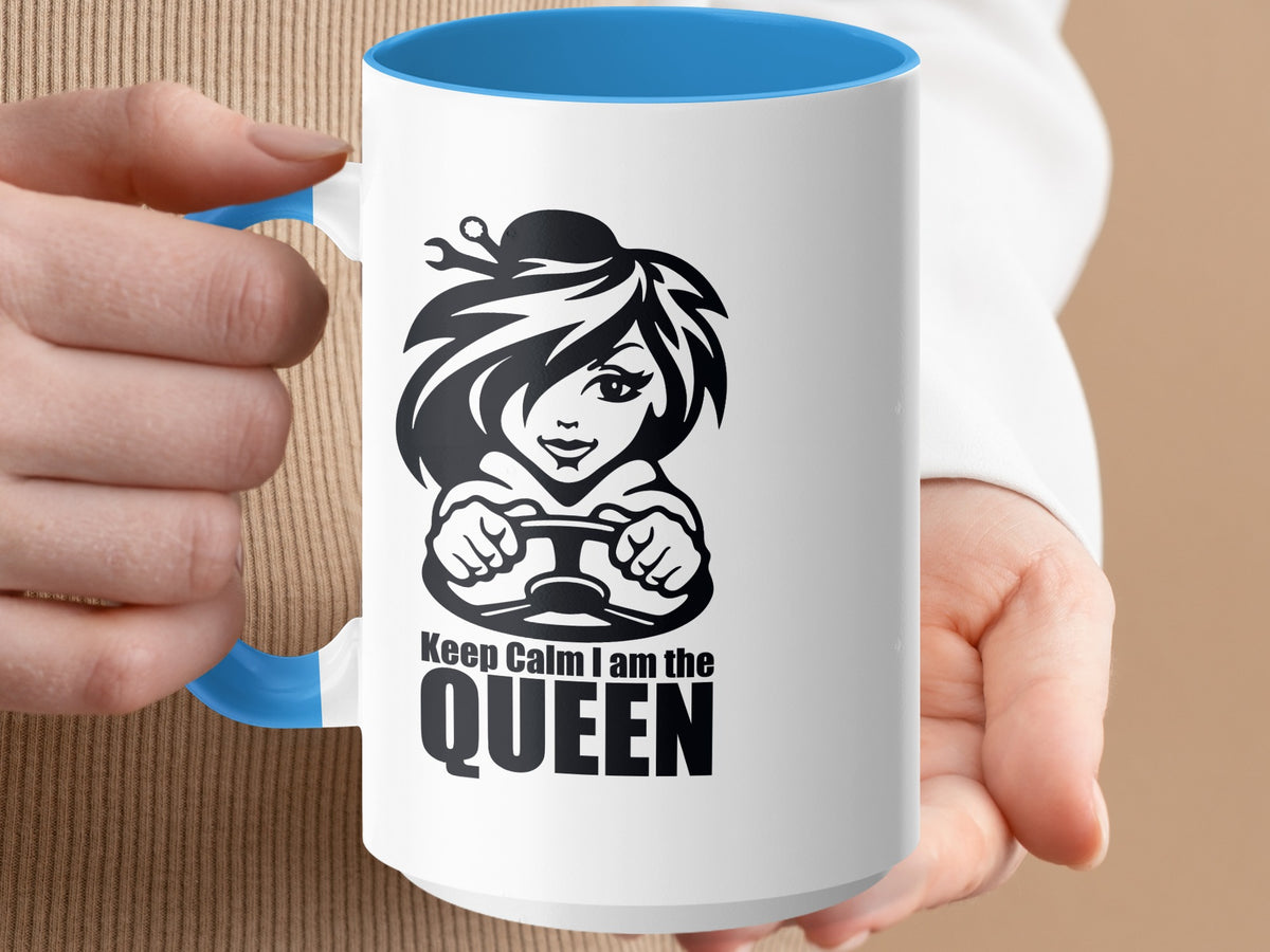 White mug with blue interior and handle, featuring a cartoon driver and text "Keep Calm I am the QUEEN".