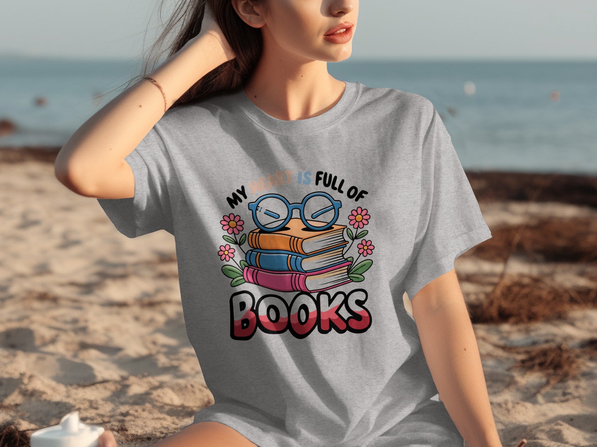 Gray t-shirt with a stack of books graphic and text "My heart is full of books".