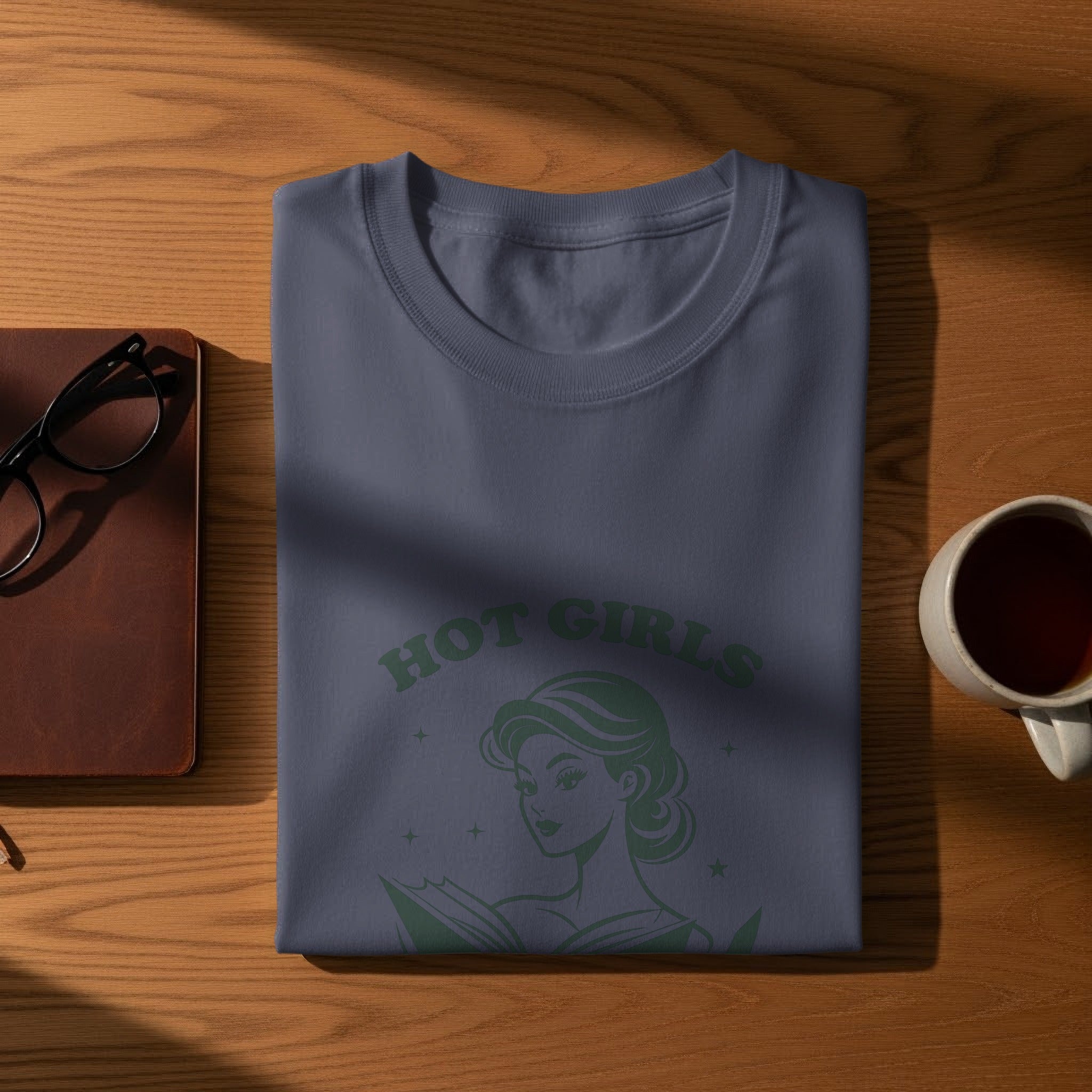 Dark blue t-shirt with green "Hot Girls" text and reading woman graphic.