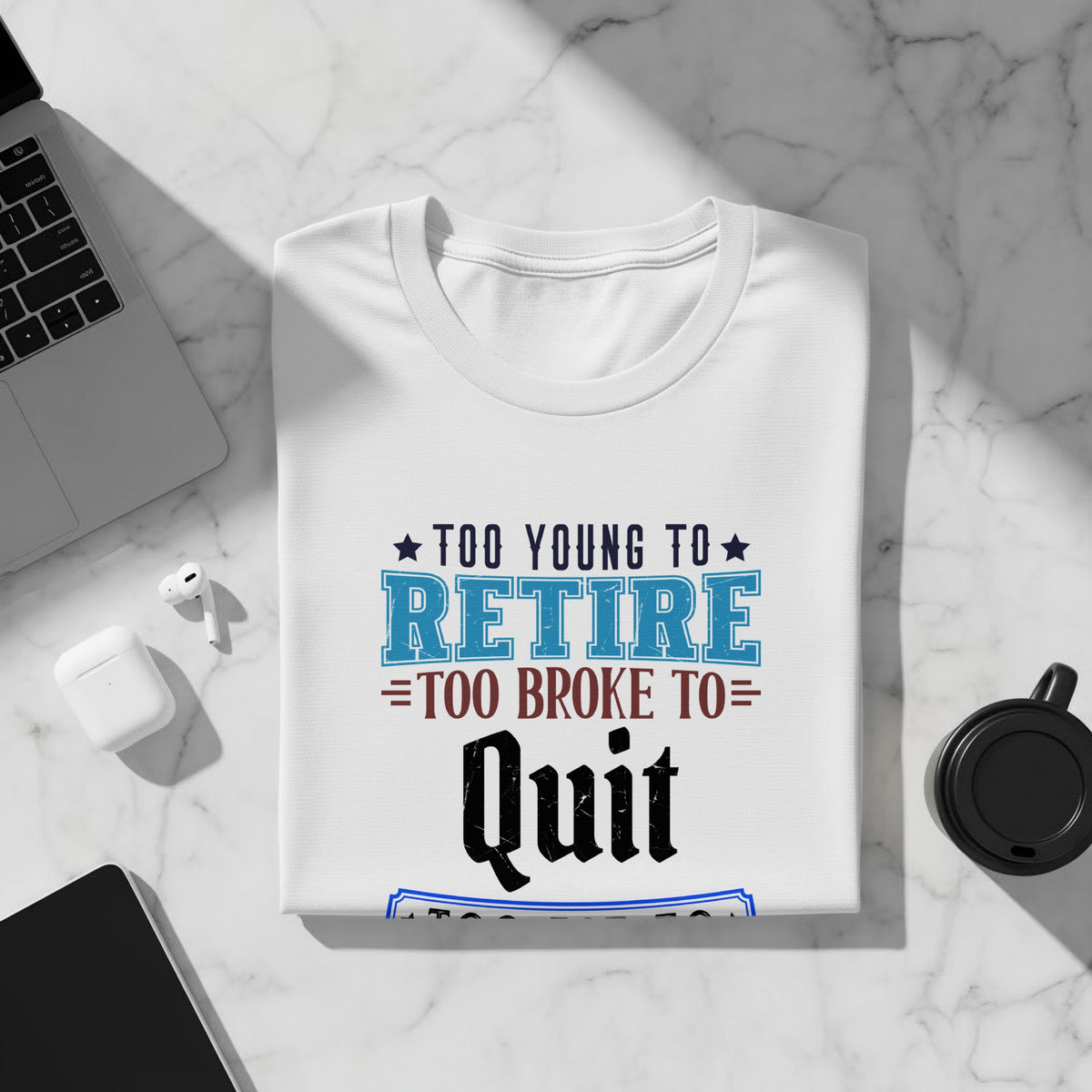 White t-shirt with "Too Young to Retire, Too Broke to Quit" graphic.