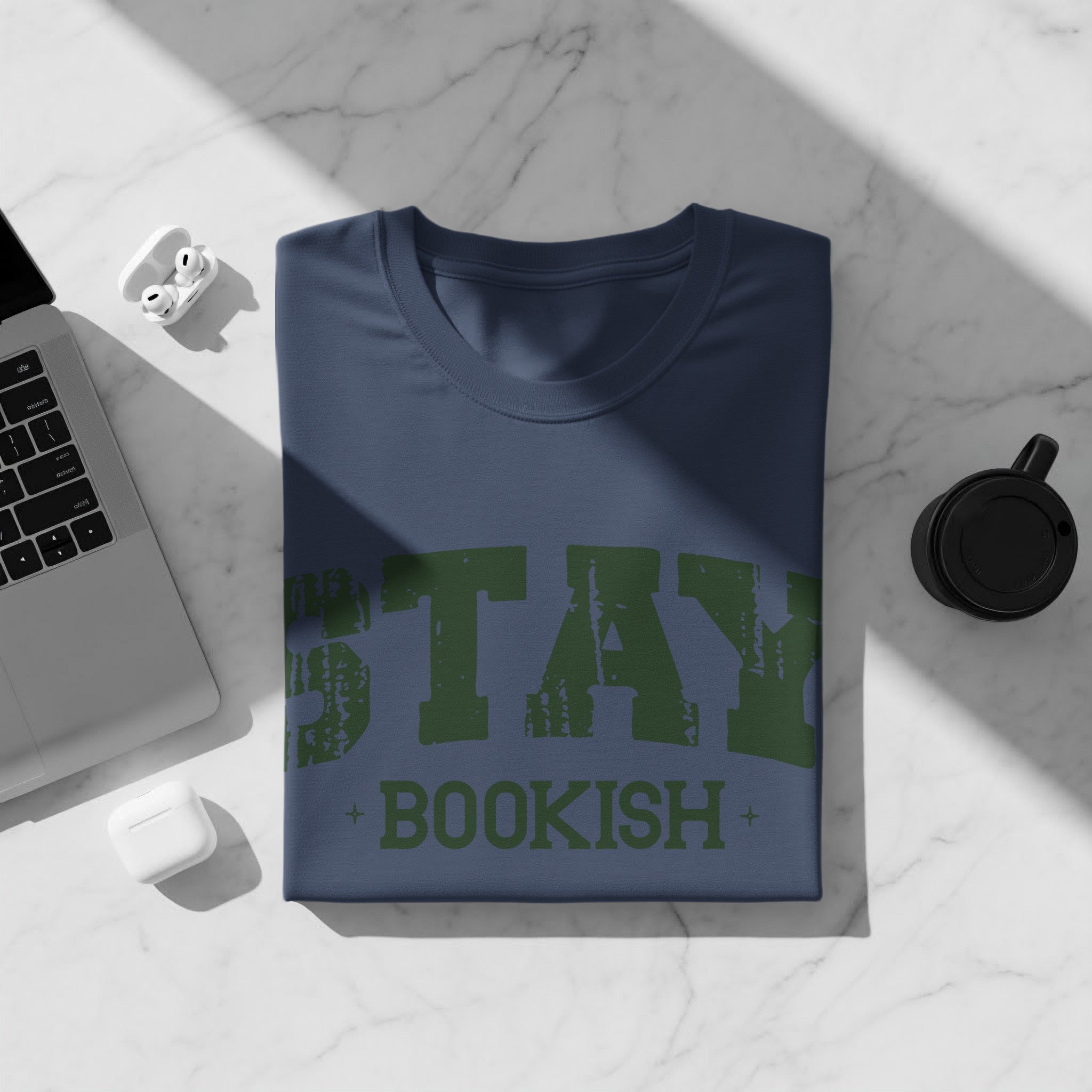 Navy t-shirt with "STAY BOOKISH" printed in green distressed text.