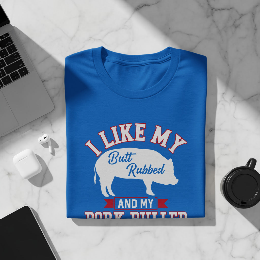 Blue t-shirt with white pig graphic and text "I LIKE MY Butt Rubbed AND MY BODY DITTED".